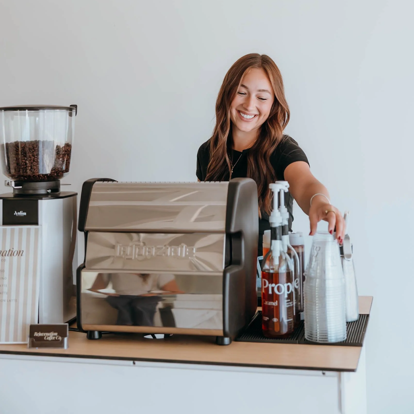 1:22 PMClaude responded: Rejuvenation Coffee Co.Rejuvenation Coffee Co. barista smiling while preparing drink order at Phoenix AZ mobile coffee cart event
