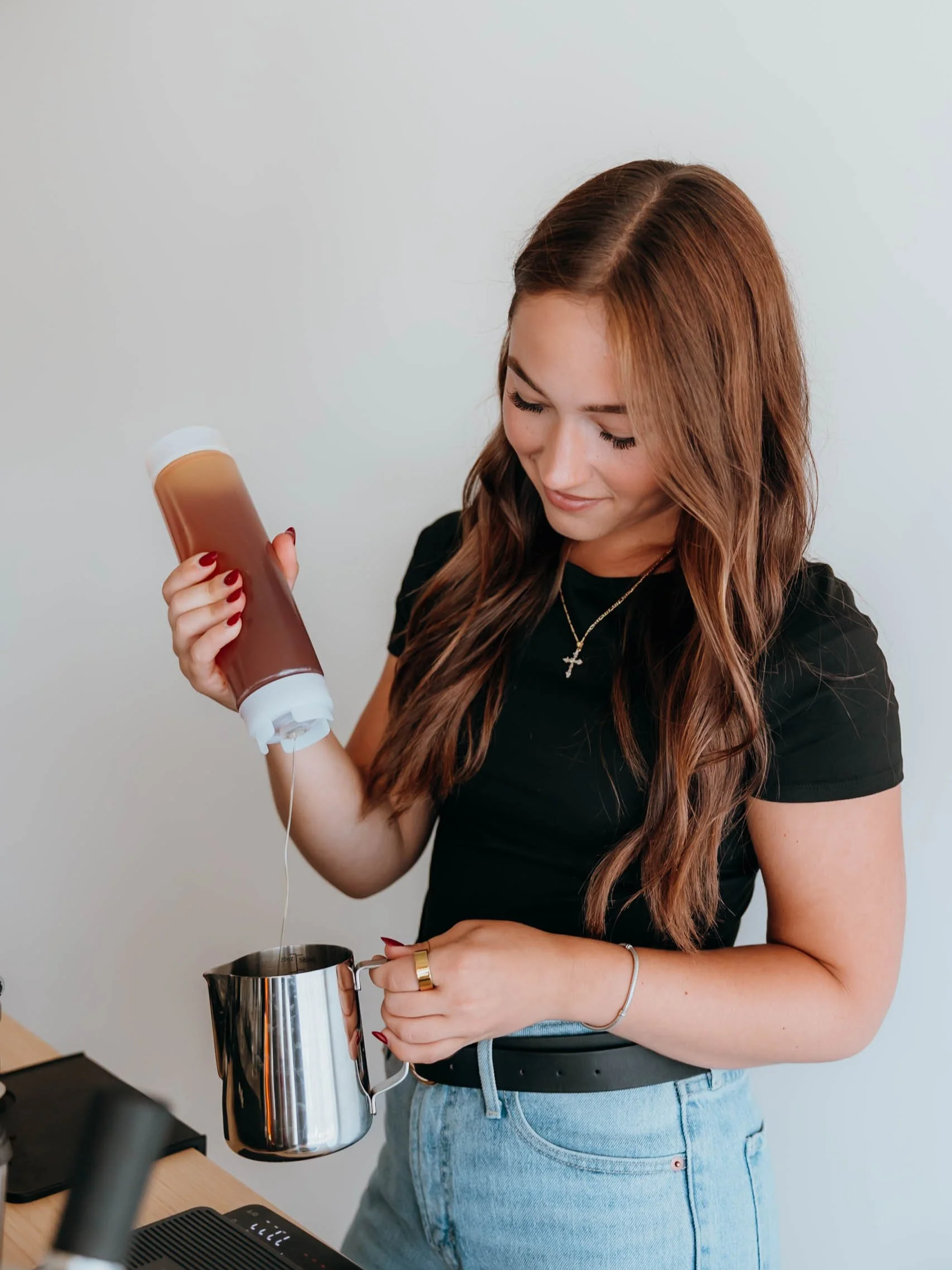 A professional barista creating a specialty coffee at an event in Scottsdale