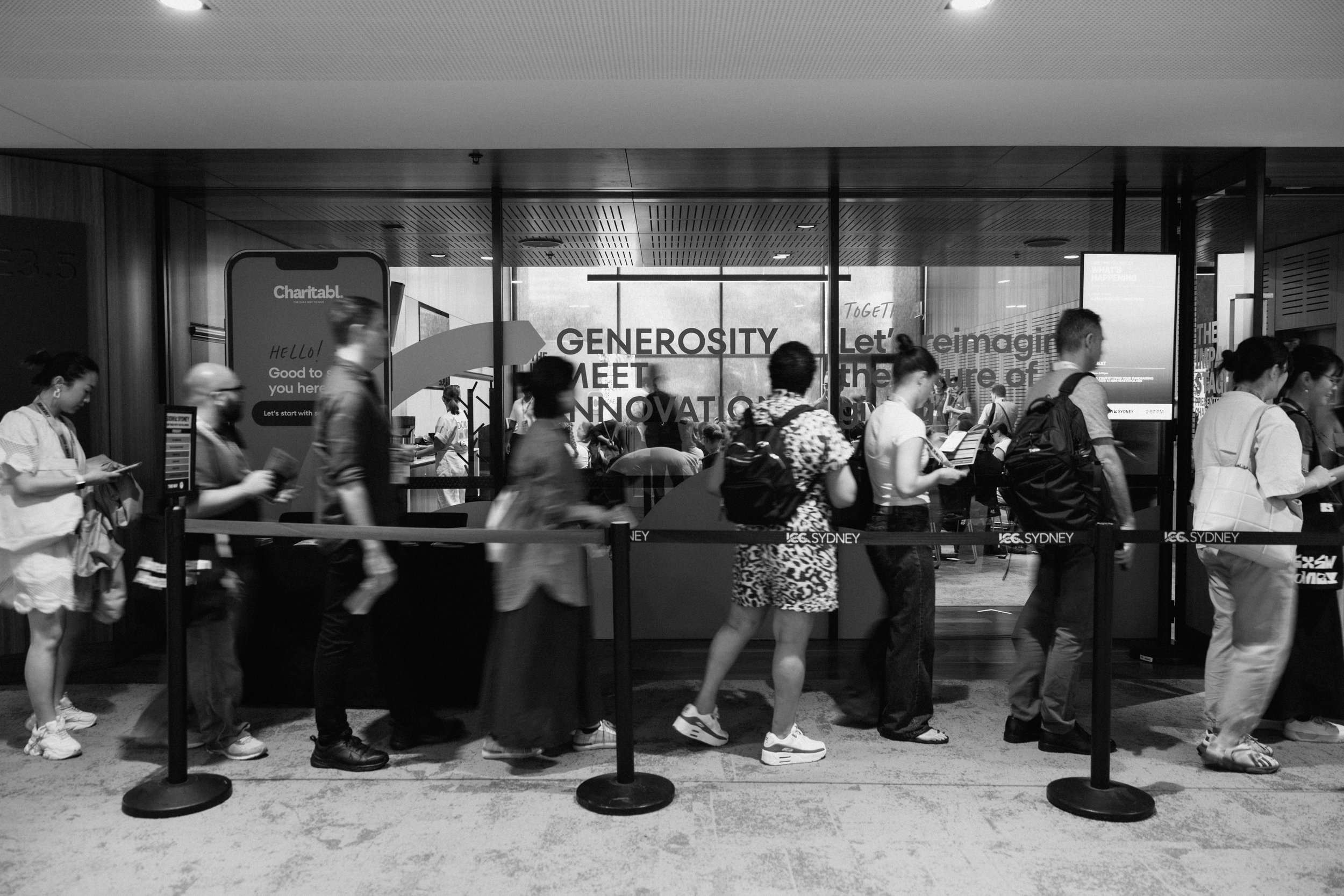 2025 Impact Stage by Charitabl. crowds waiting to get into the room.