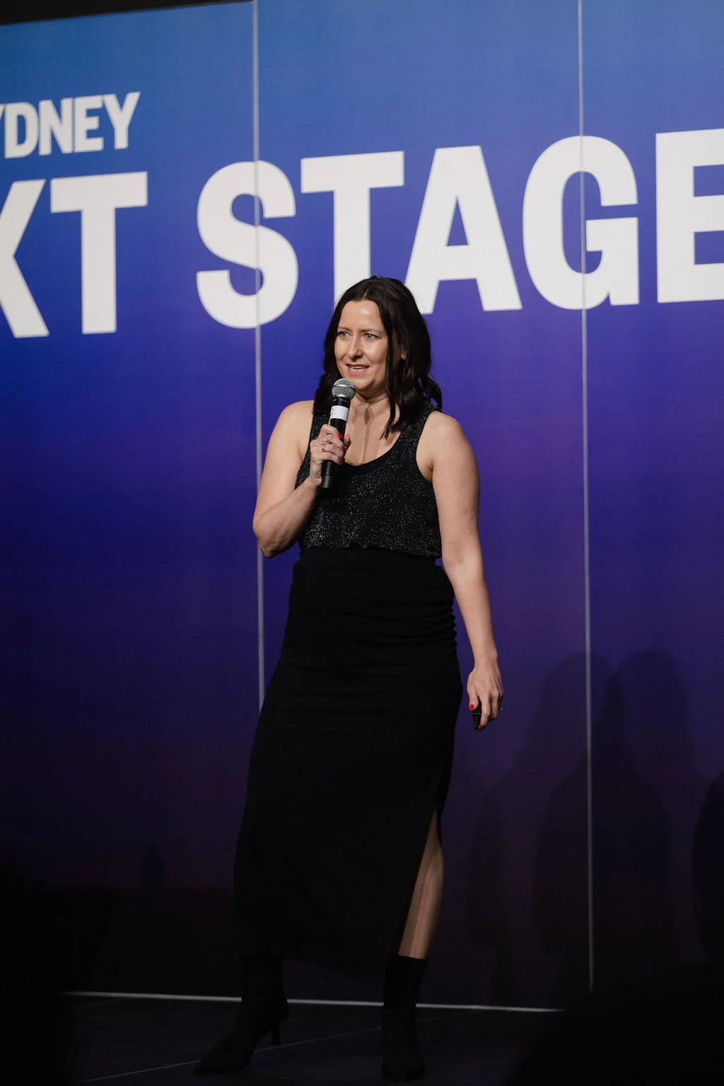 Carla Raynes from BridgeIt speaking at the 2025 Impact Stage 