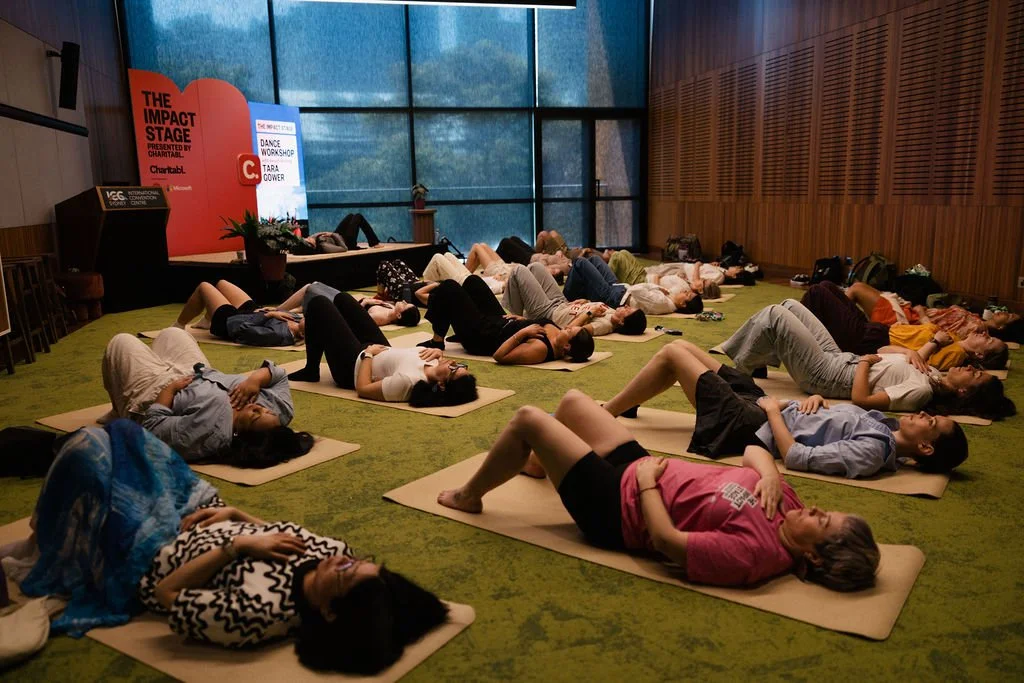 Tara Gower from Minderoo running a dance workshop at the 2025 Impact Stage presented by Charitabl.