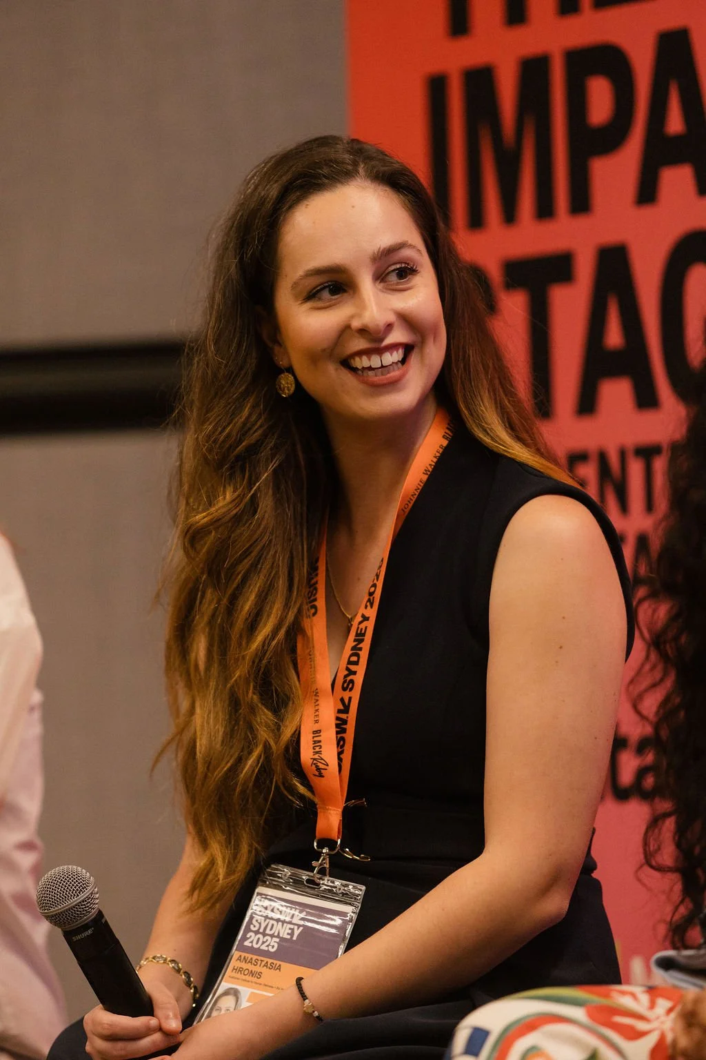 Dr Anastasia Hronis speaking at the 2025 Impact Stage presented by Charitabl.