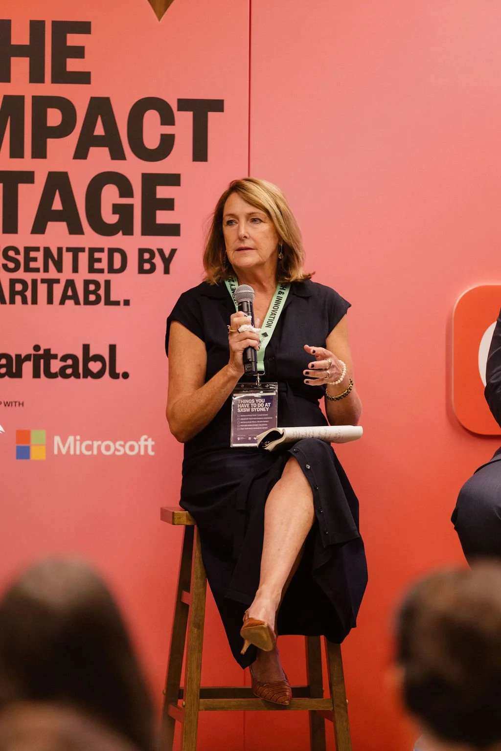 Julie Rosenberg speaking at the 2025 Impact Stage presented by Charitabl.