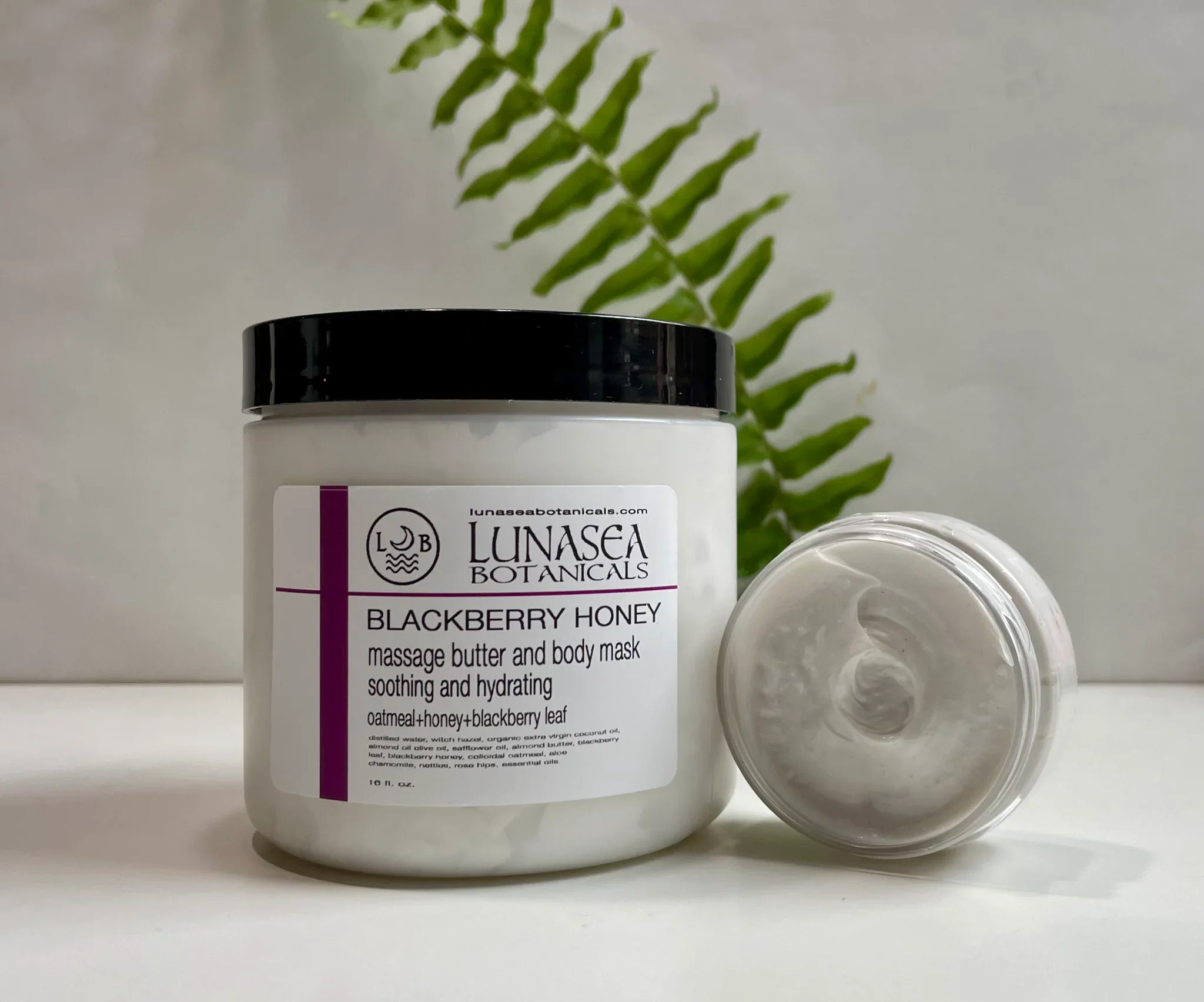 A jar of Lunasea Botanicals Blackberry Honey massage butter and body mask. Used in Spa for hot stone massage and head spas by Lori Miller in Saskatoon at Central Hair District.