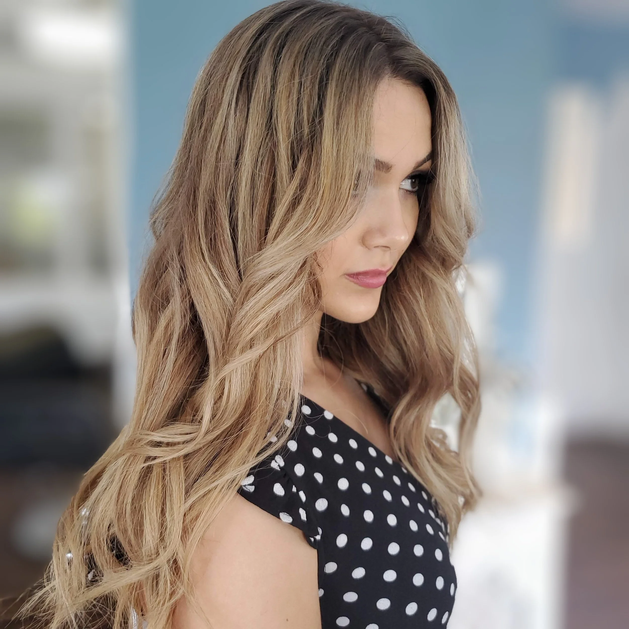 Brunette hair color with blonde balayage and highlights, Toned to a caramel blonde in Saskatoon at Central Hair District formerly Lavish District