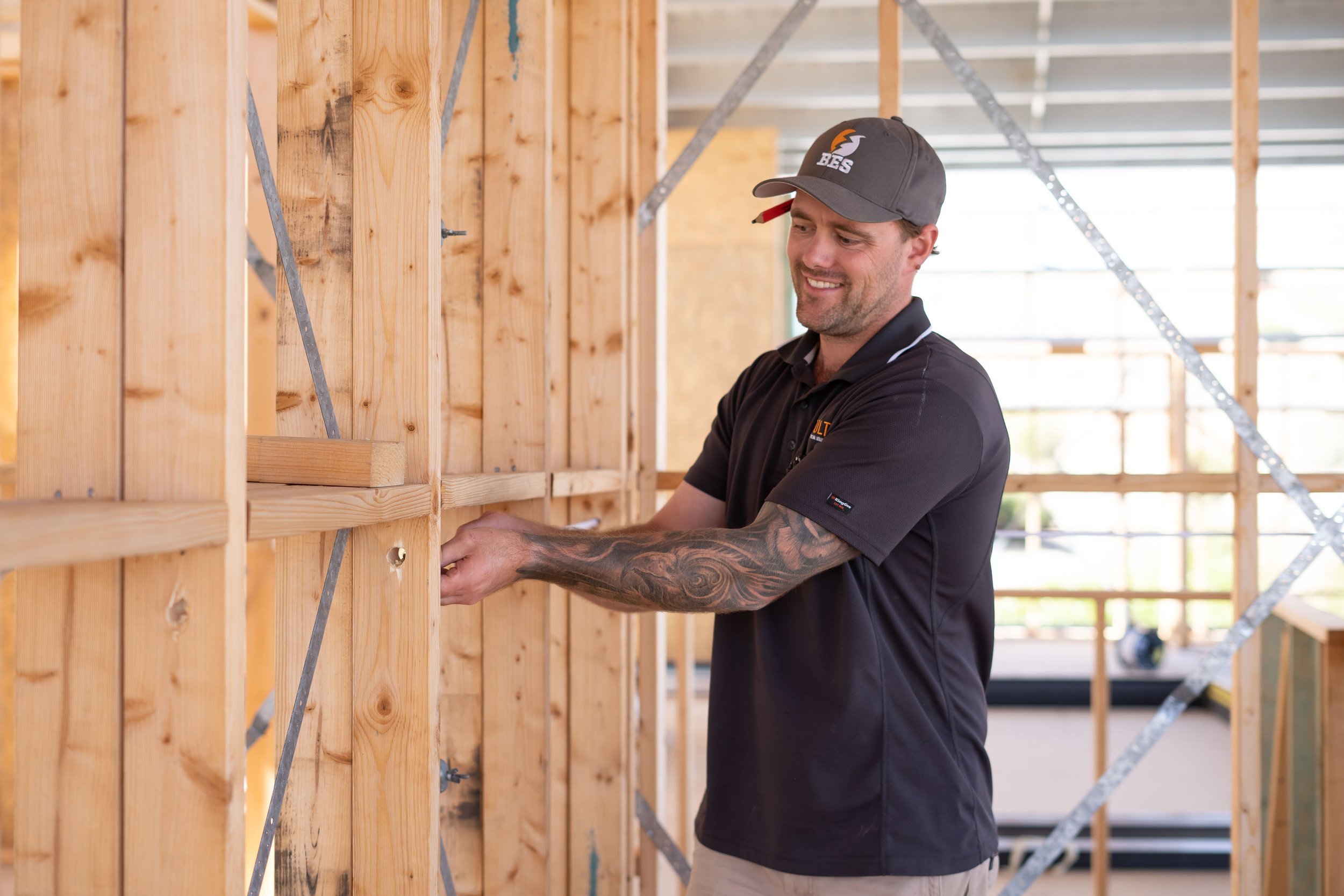 electrician installing cables to a first fix home