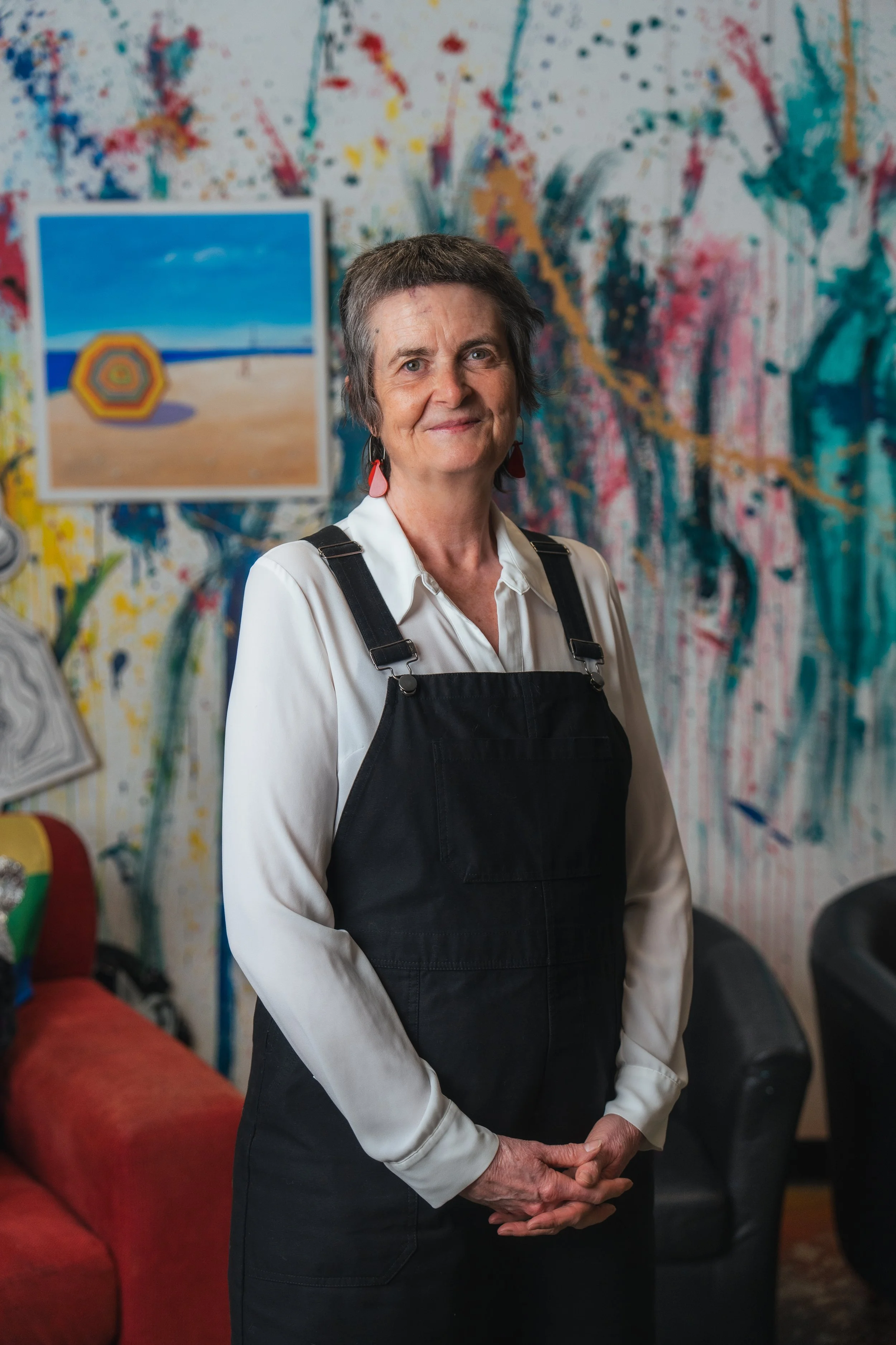 headshot of a female executive inside of an art gallery