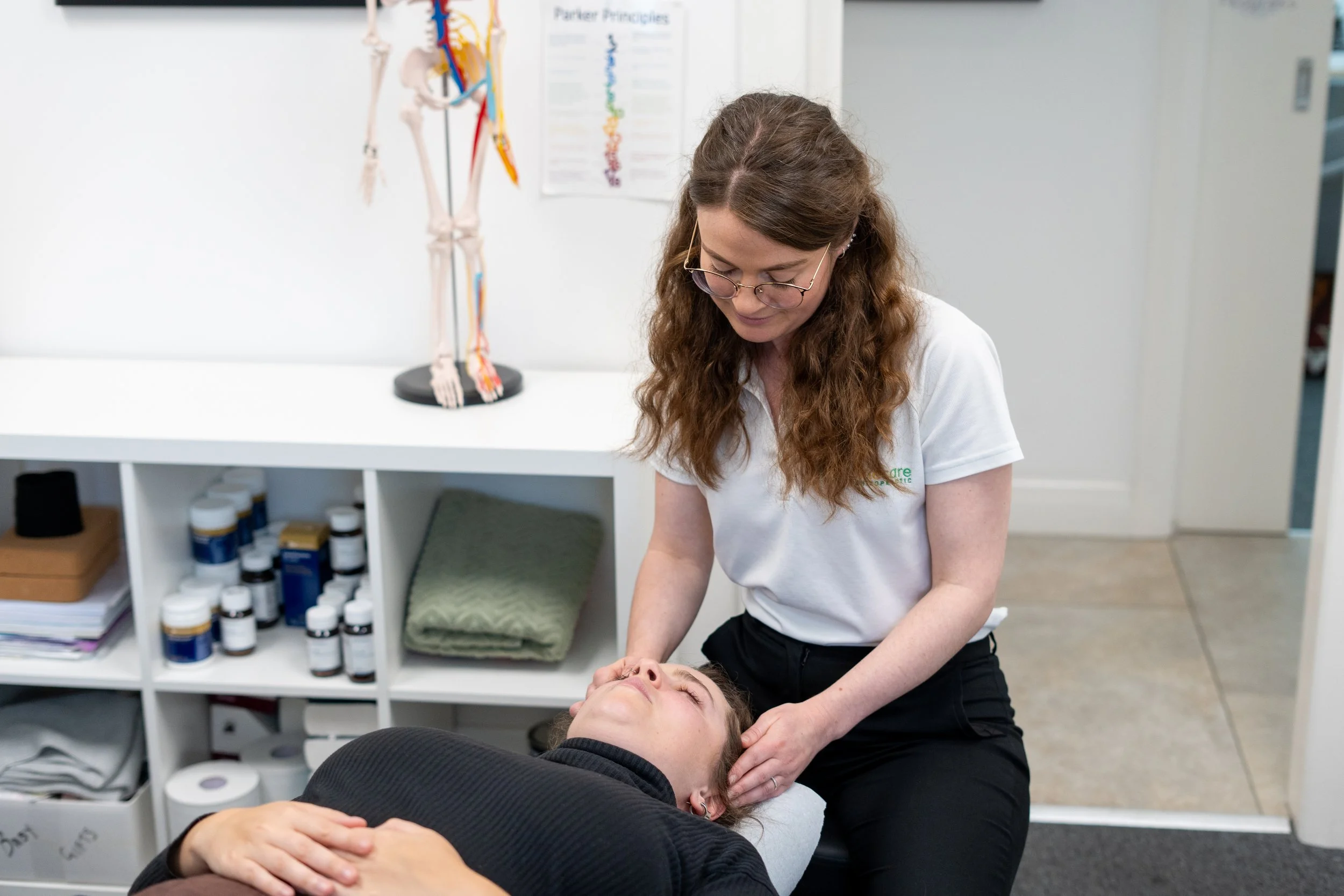 a female chiropractor treating a female client