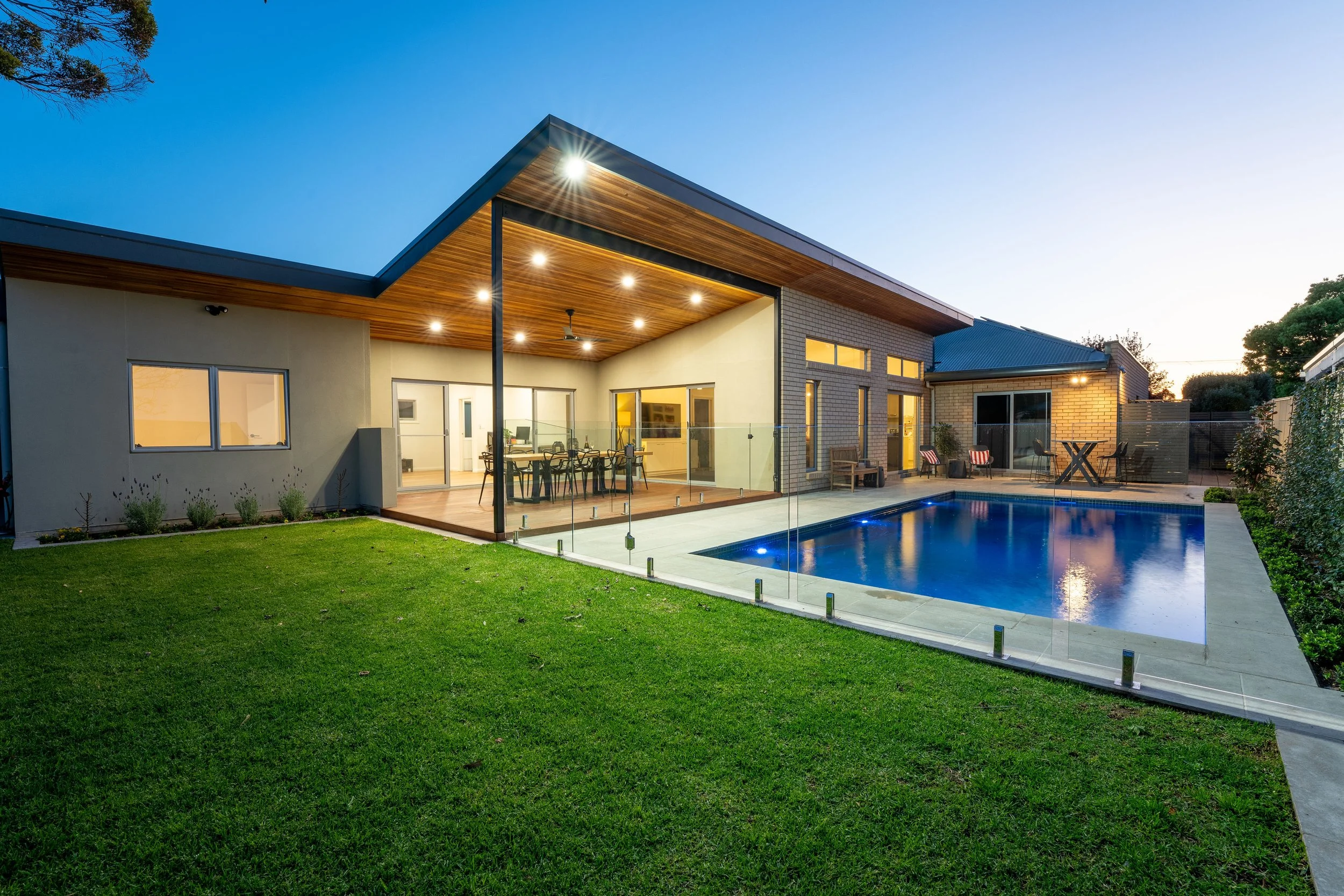 backyard with timber decking and a pool