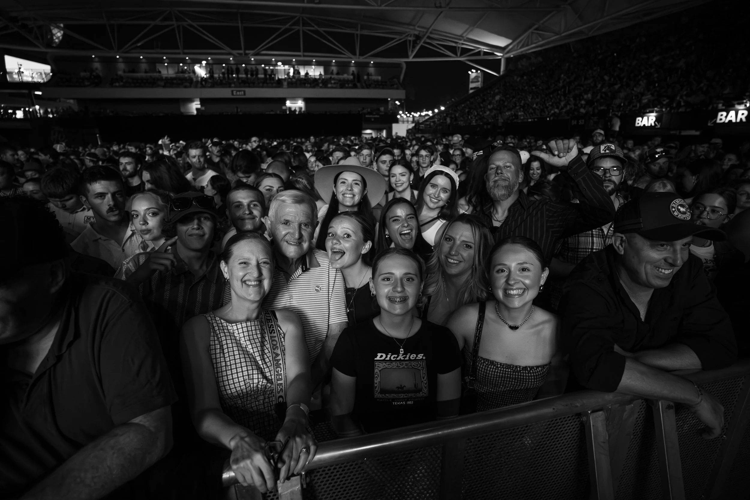 crowd smiling at a Tyler Childers concert