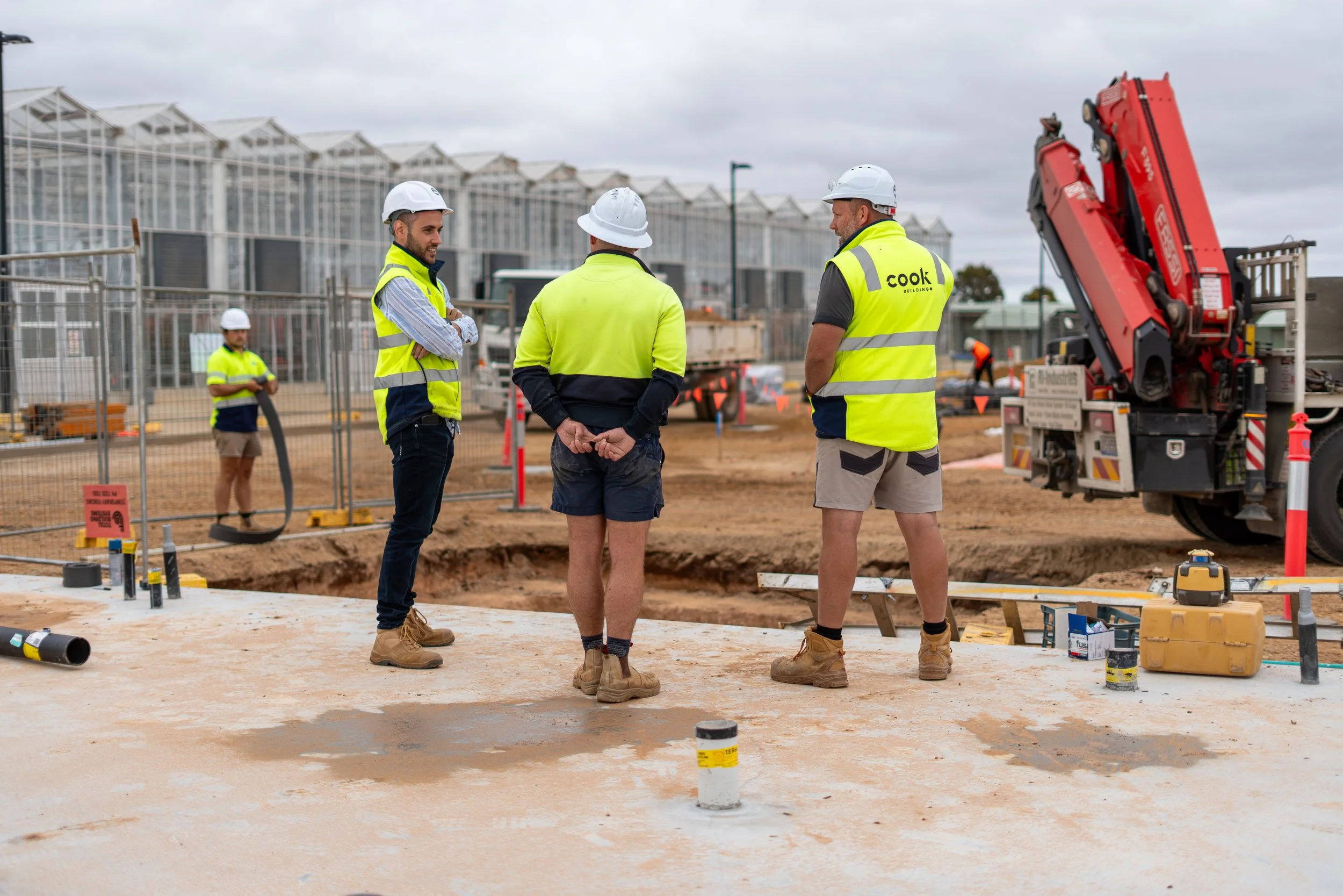 Constructions workers talking on construction site