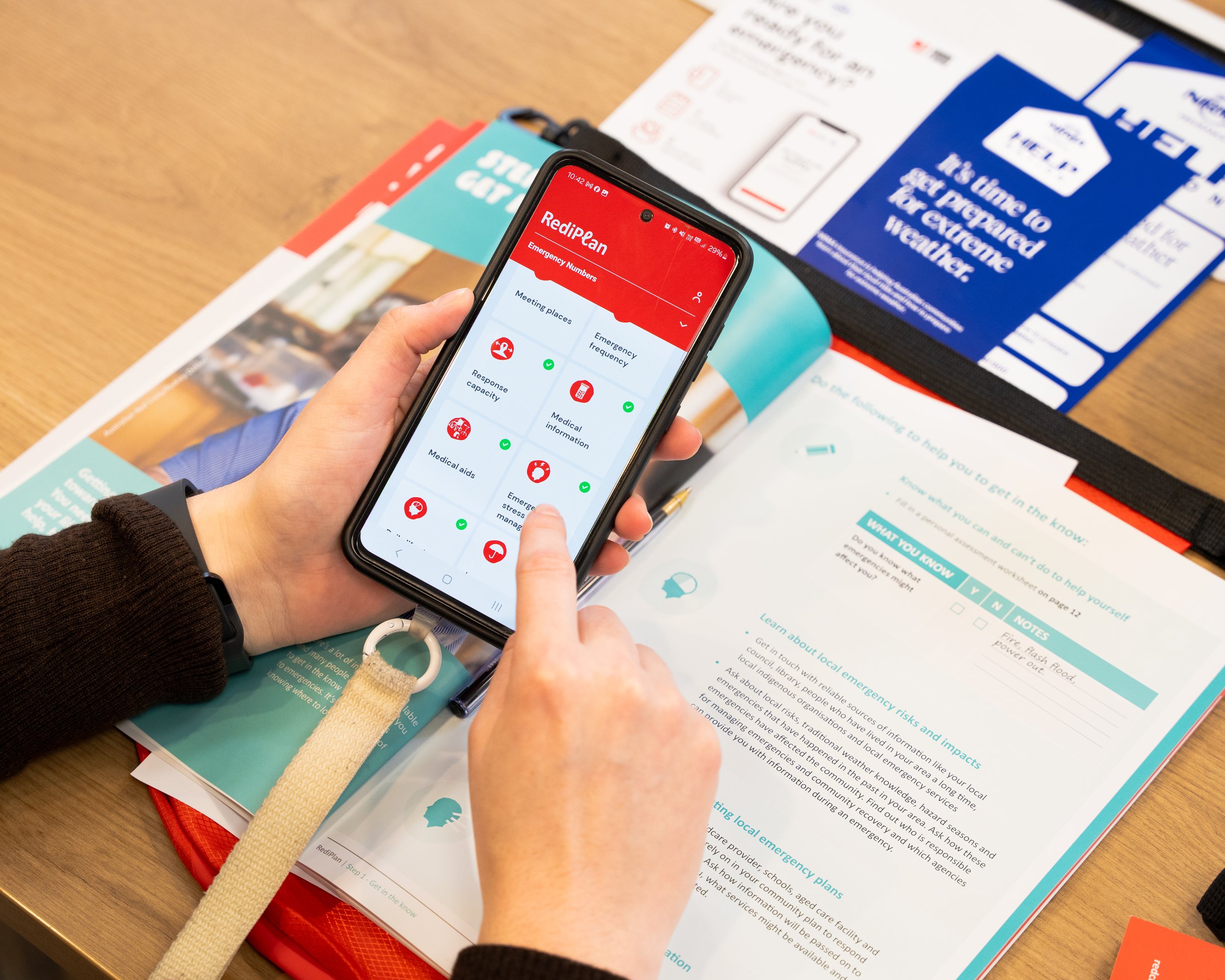 person using phone to complete an online safety document