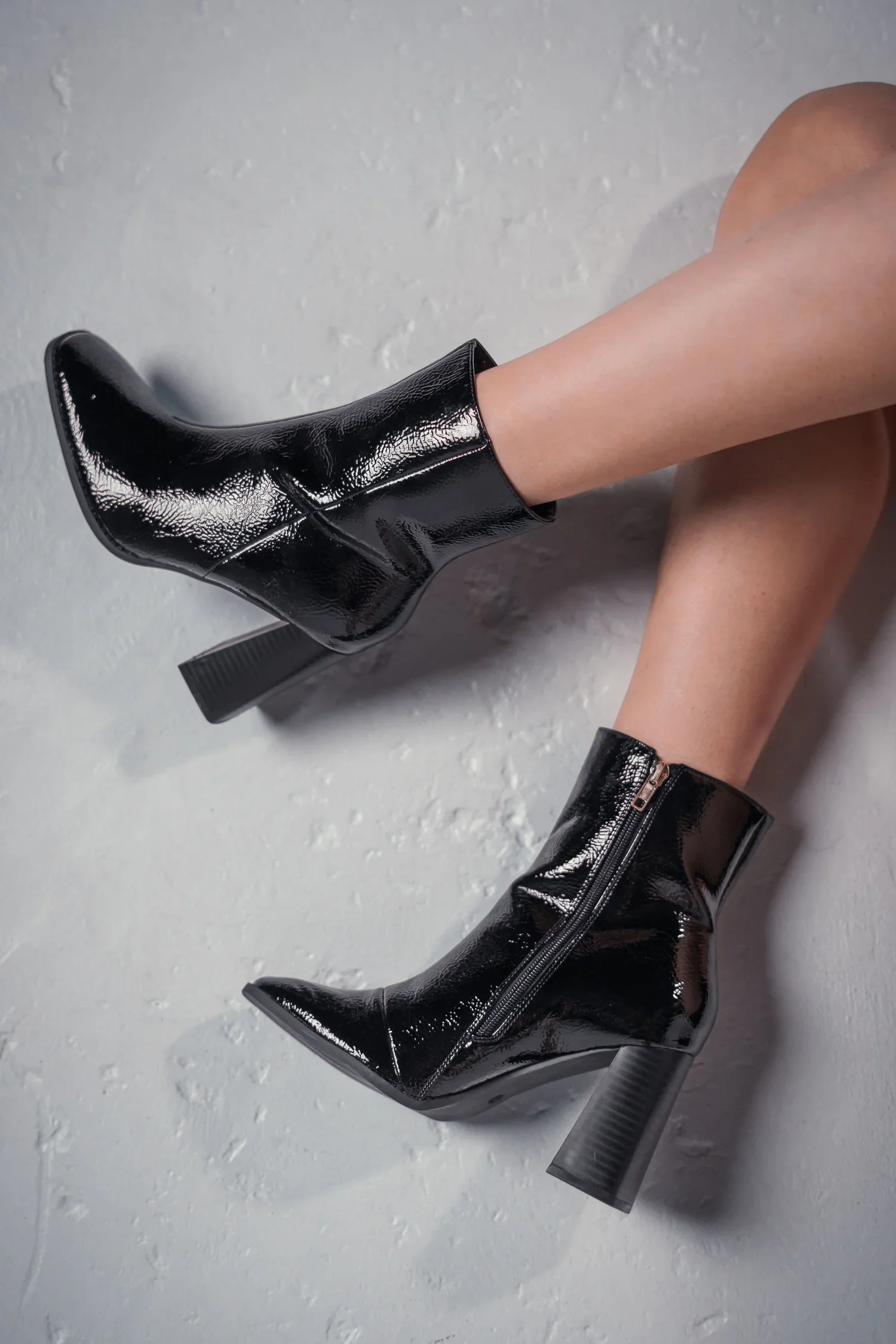 woman wearing black high heel boots