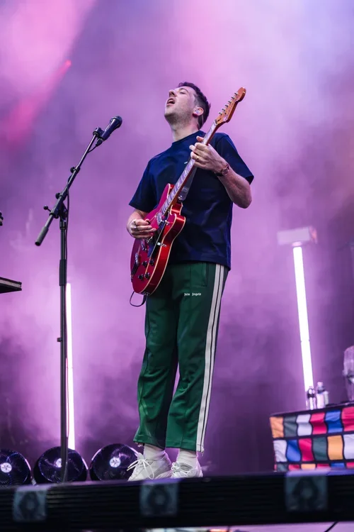 The Wombats frontman, Matthew "Murph" Murphy jumping while playing guitar at a music festival in McLaren Vale, South Australia
