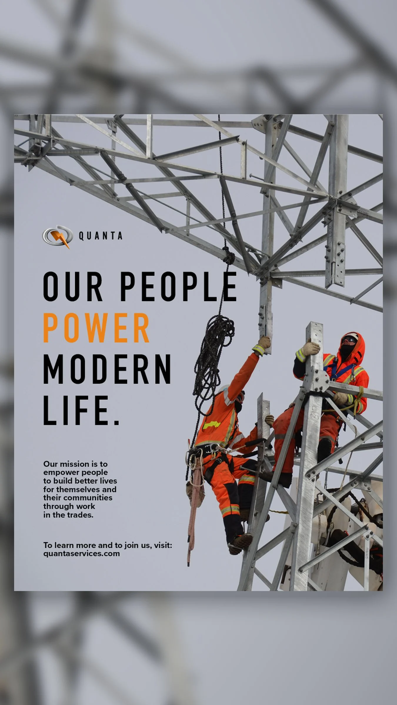 Workers in orange safety gear working on a tall metal transmission tower.