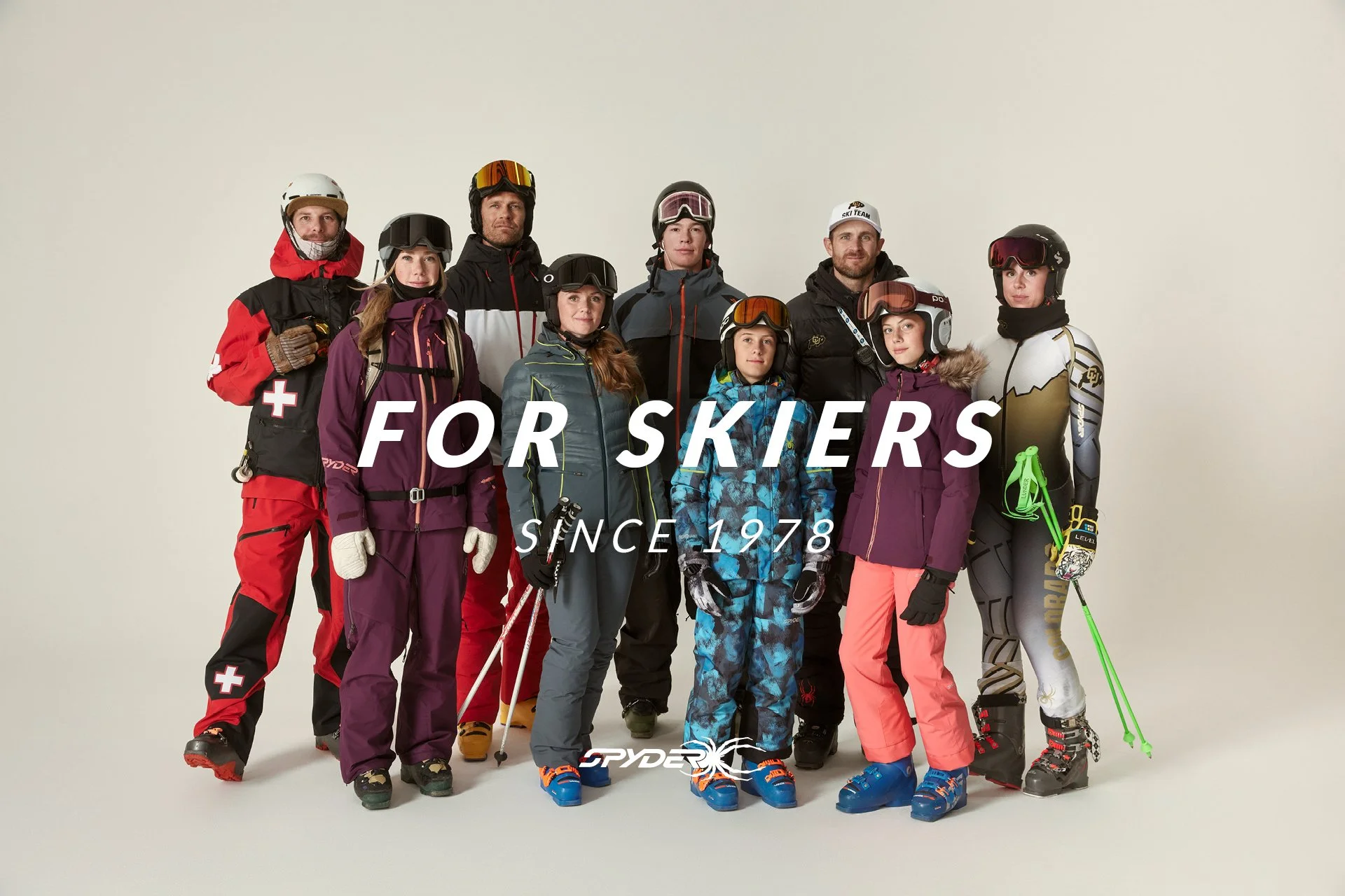 Group of skiers in ski gear standing against a plain background with text overlay that reads 'For Skiers Since 1978' and the Spyder logo.