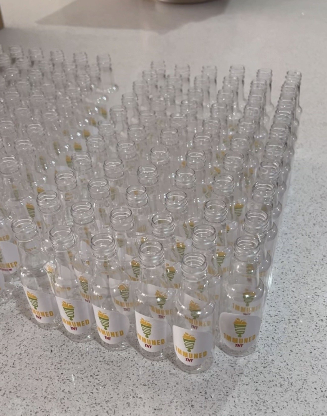 1MMUNED TNT immunity shots arranged on countertop