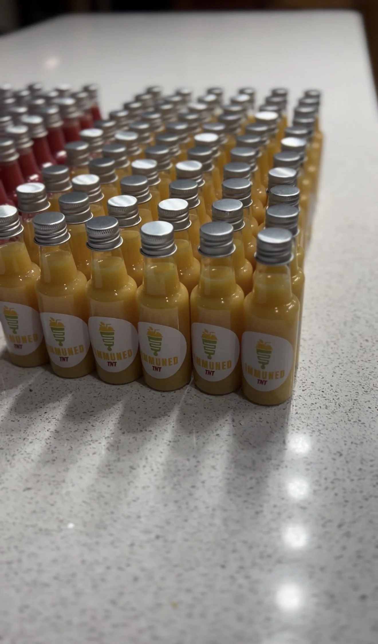 1MMUNED TNT immunity shots arranged in rows