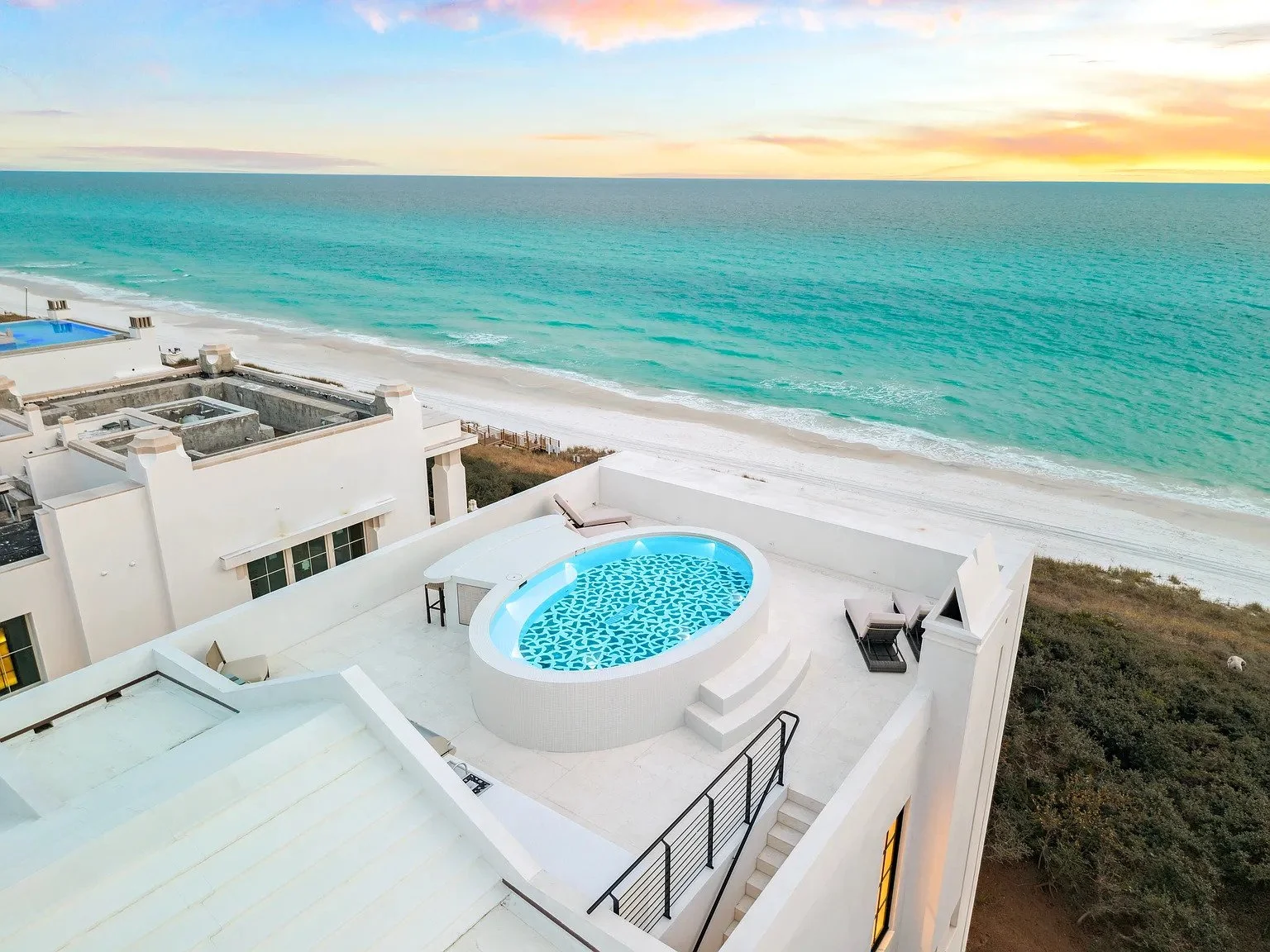 001-HERO-rooftop-pool-aerial-sunset-beach.jpg