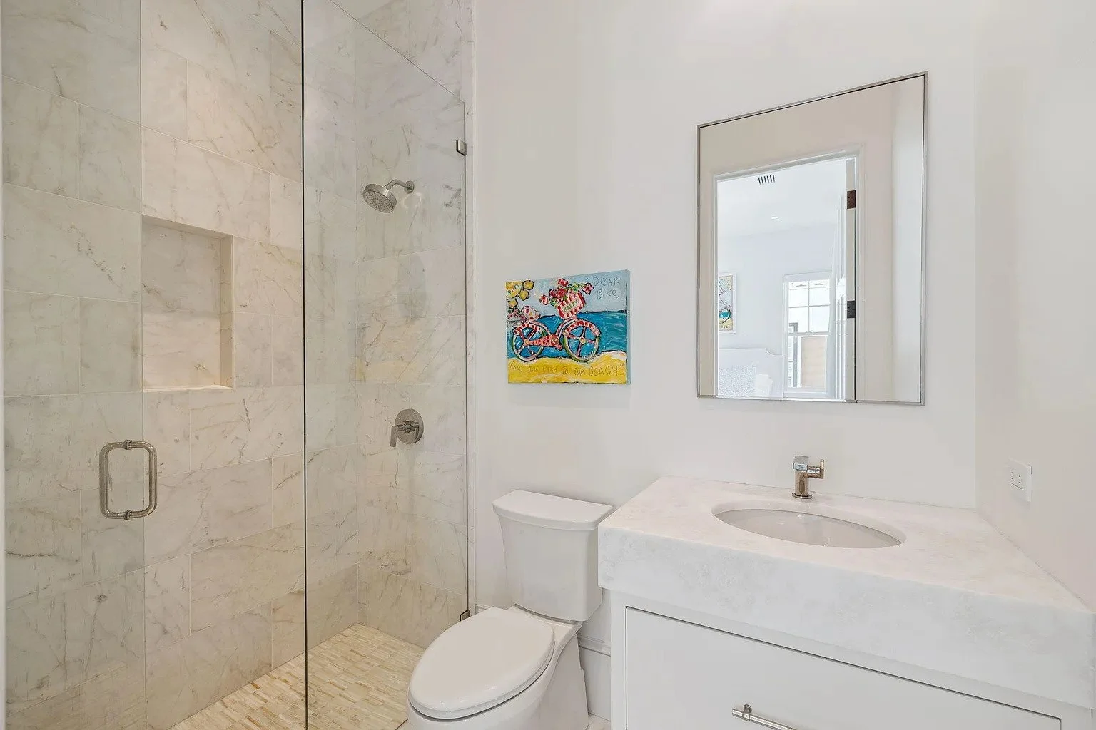 047-guest-bath-marble-shower-beach-art.jpg