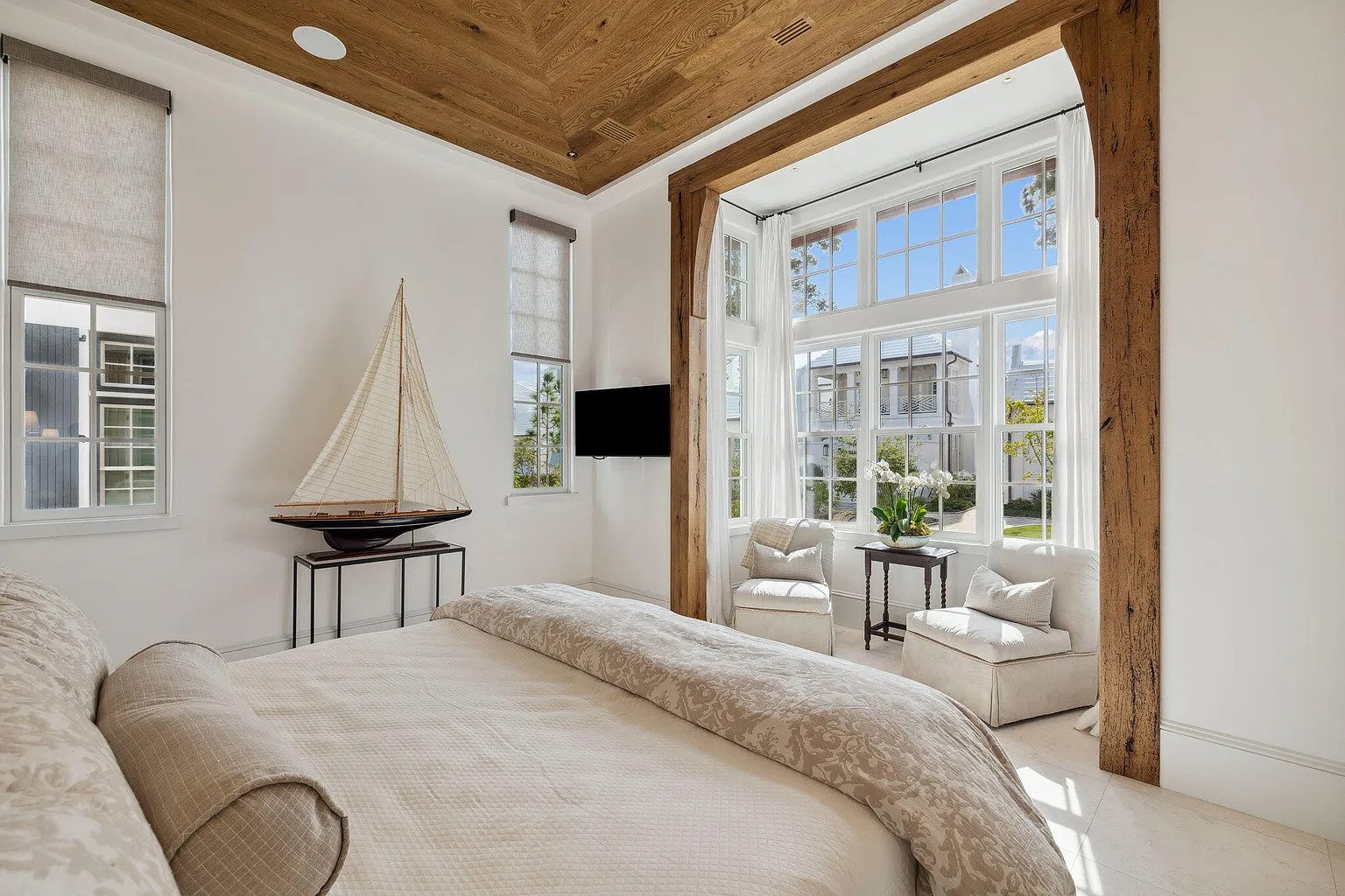 037-guest-bedroom-wood-ceiling-bay-window.jpg