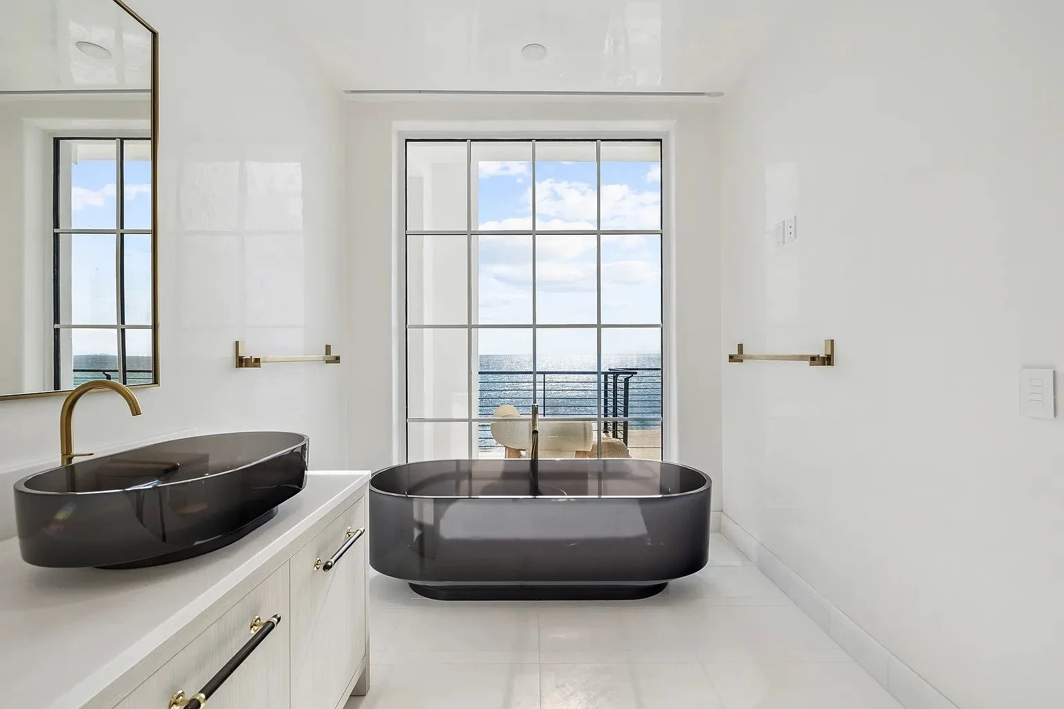 032-master-bath-black-tub-ocean-view.jpg