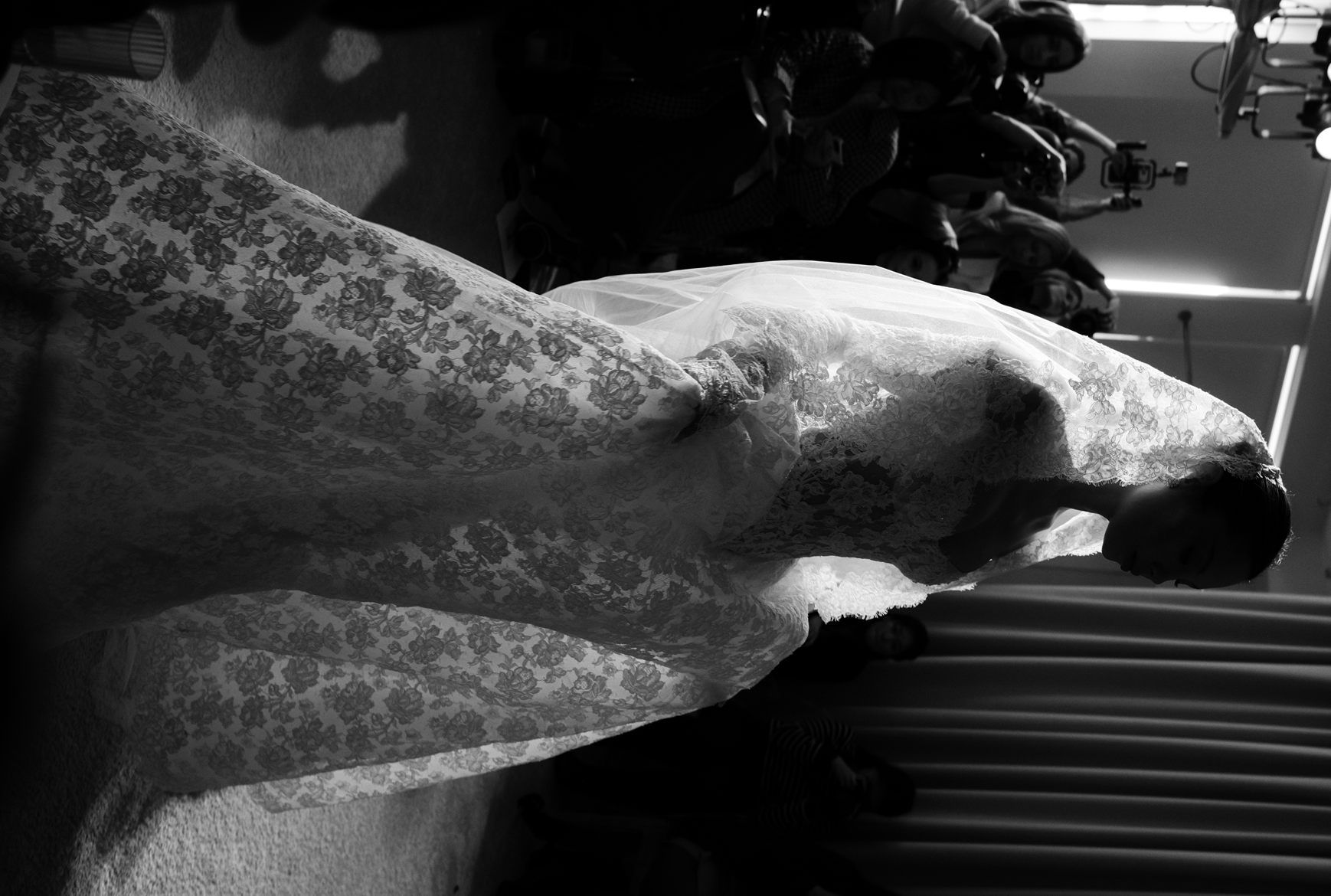 Close-up of bride in intricate lace wedding gown, luxury wedding photography PURR Studio