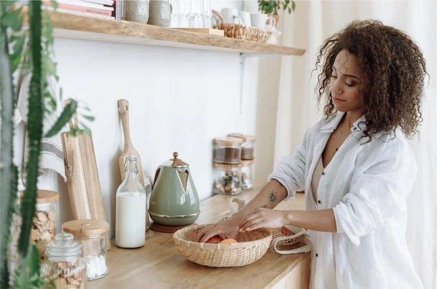 Professional organizer creating functional kitchen organization systems designed to simplify daily routines and support long-term home organization.