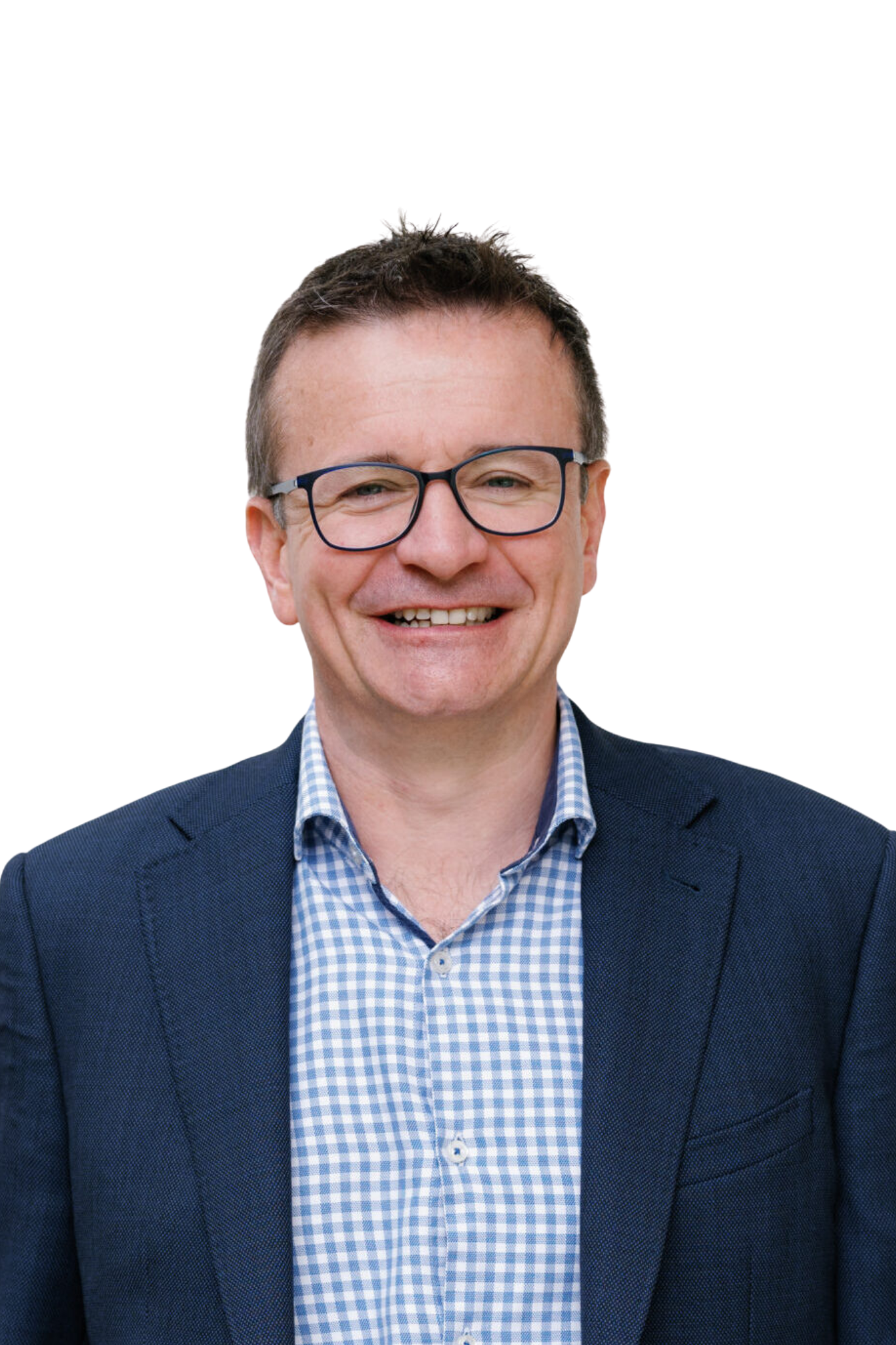 Smiling man wearing glasses, a blue suit, and a checkered shirt.