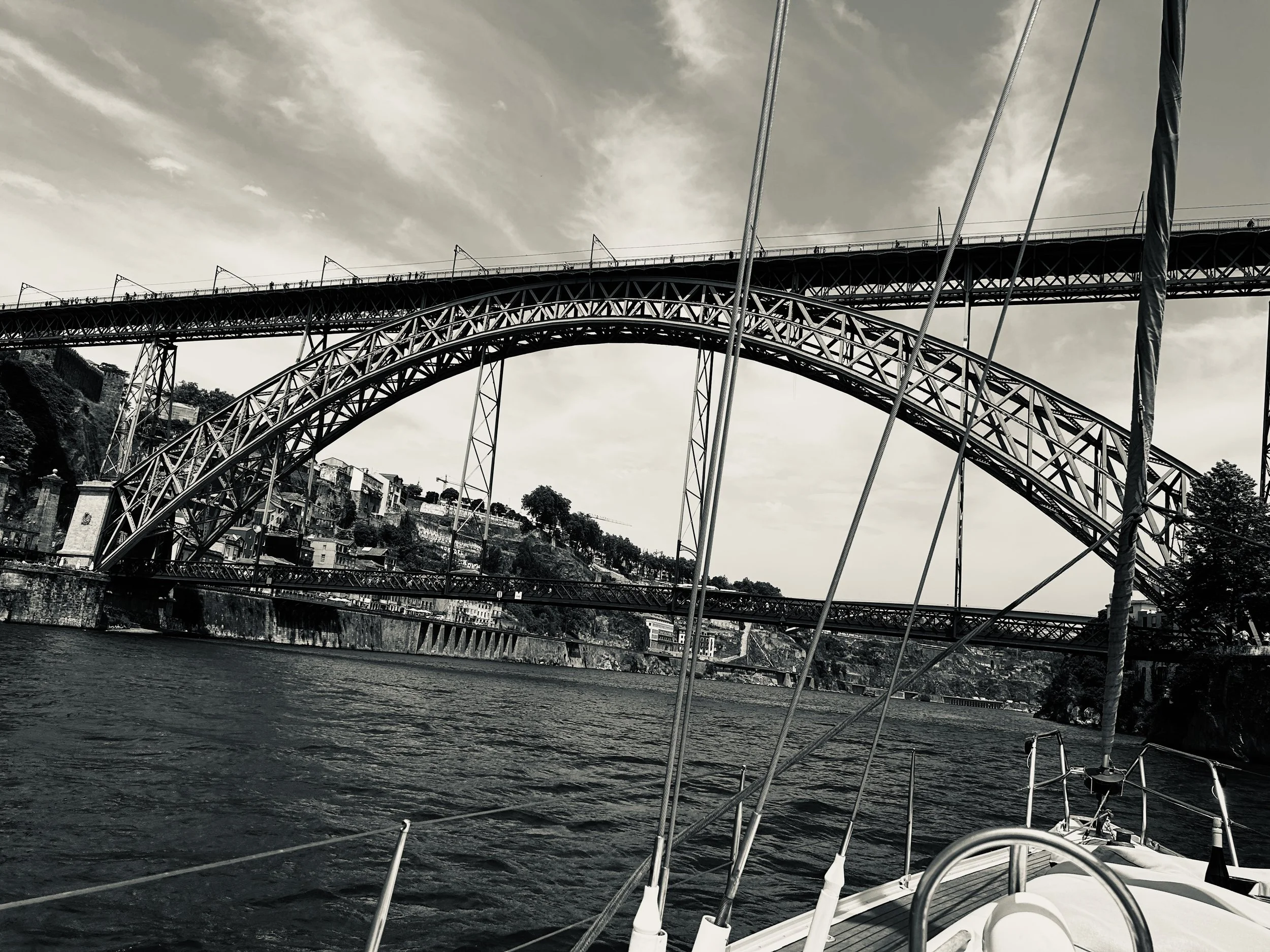 Admiring the Dom Luís I Bridge from a Douro river cruise - Porto, Portugal