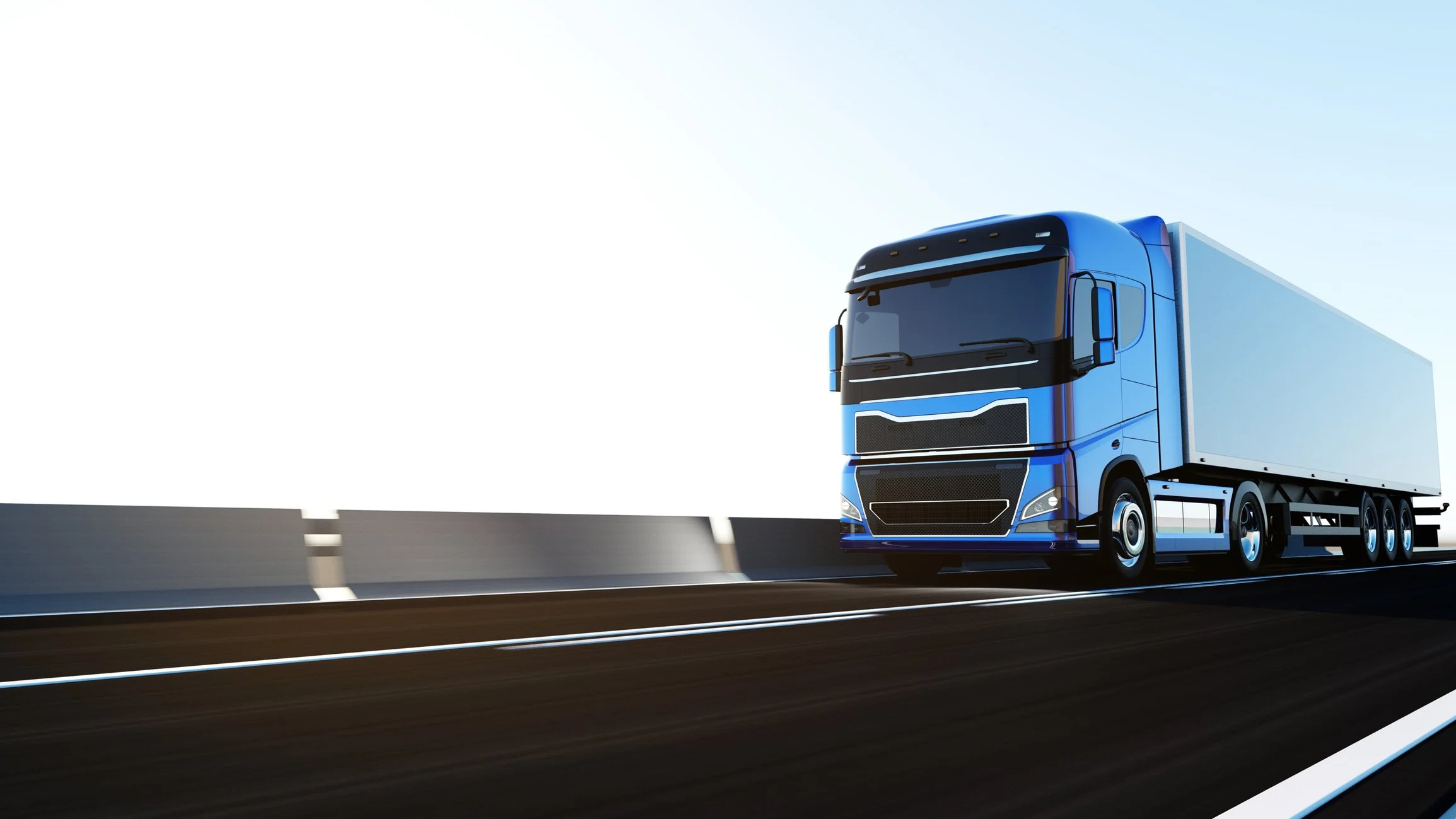 Ein blauer Lastwagen fährt auf einer Autobahn.