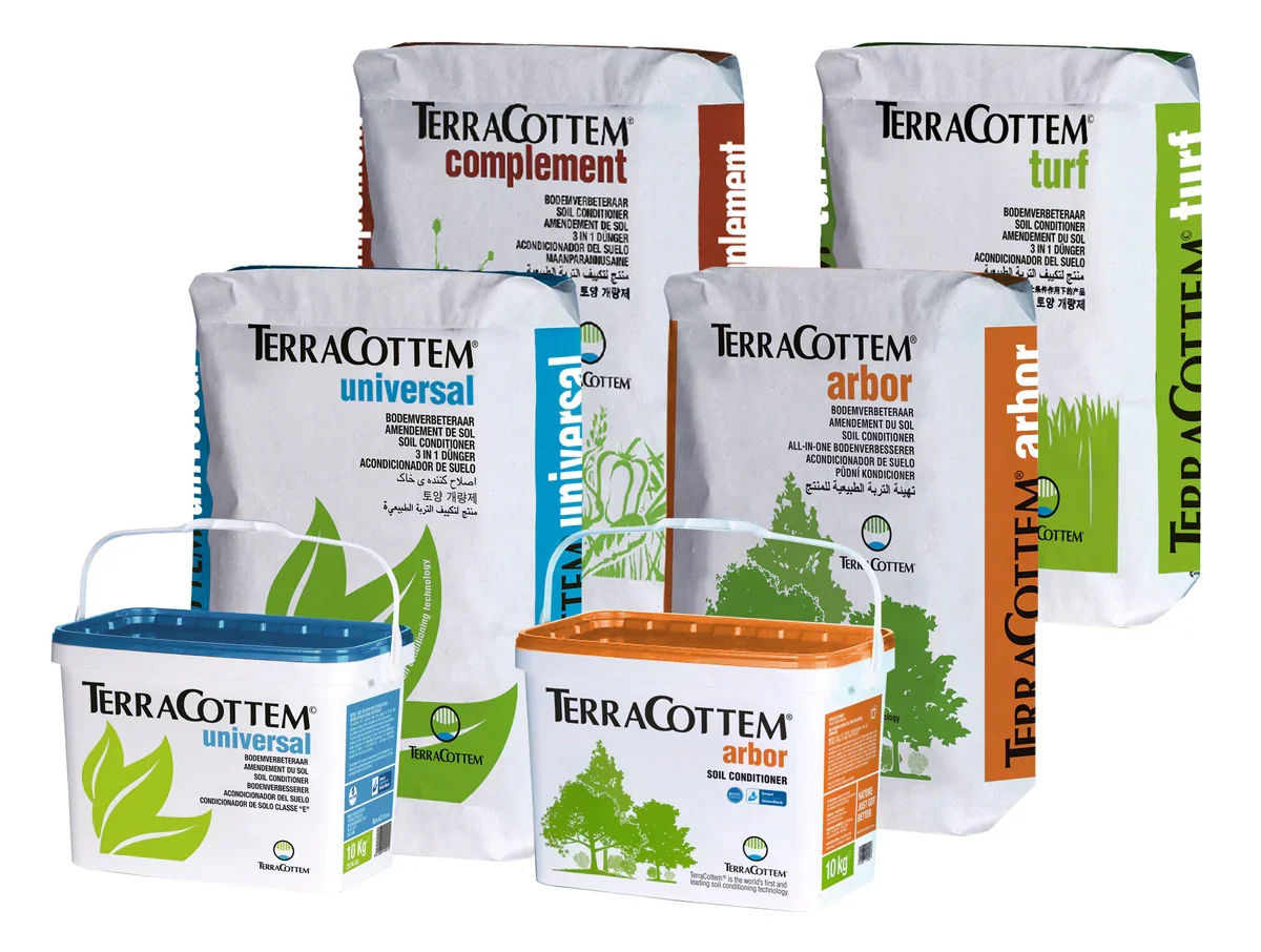 Multiple bags and containers of TerraCottem soil conditioners and amendments, including universal, arbor, turf, and supplement, arranged for display.