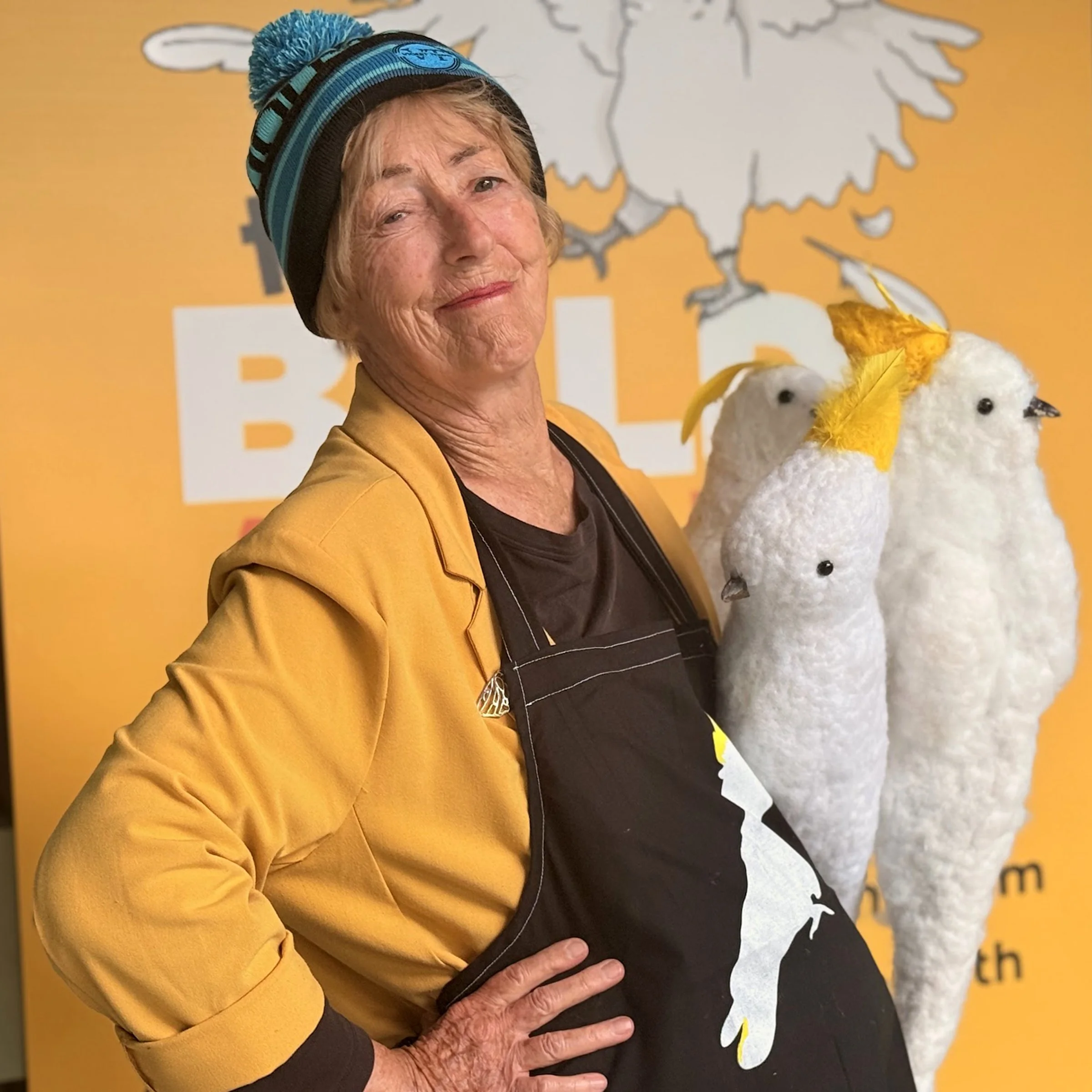 Helena Gibson with some of the cockatoo characters crafted by members of the Violet Town Community House, who will be welcoming people from the trees that grace the entrance of the exhibition.