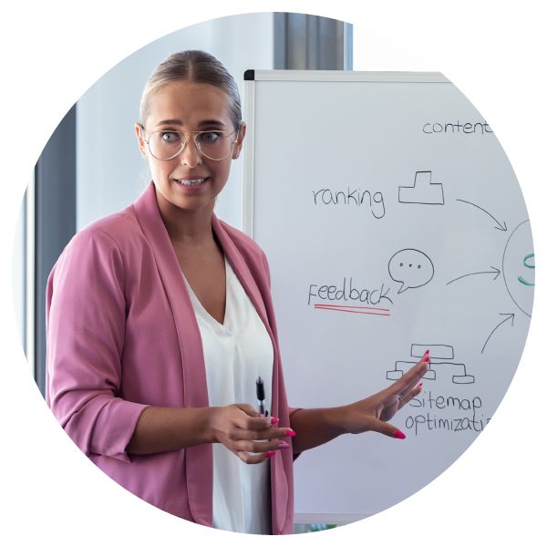 Female project manager leading a team, reviewing plans and coordinating tasks.