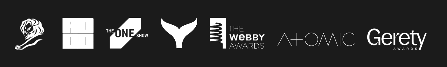 Logos for various awards and shows, including a lion, a crossword, The One Show, a stylized Y, The Webby Awards, Atomic, and the Gerety Awards.