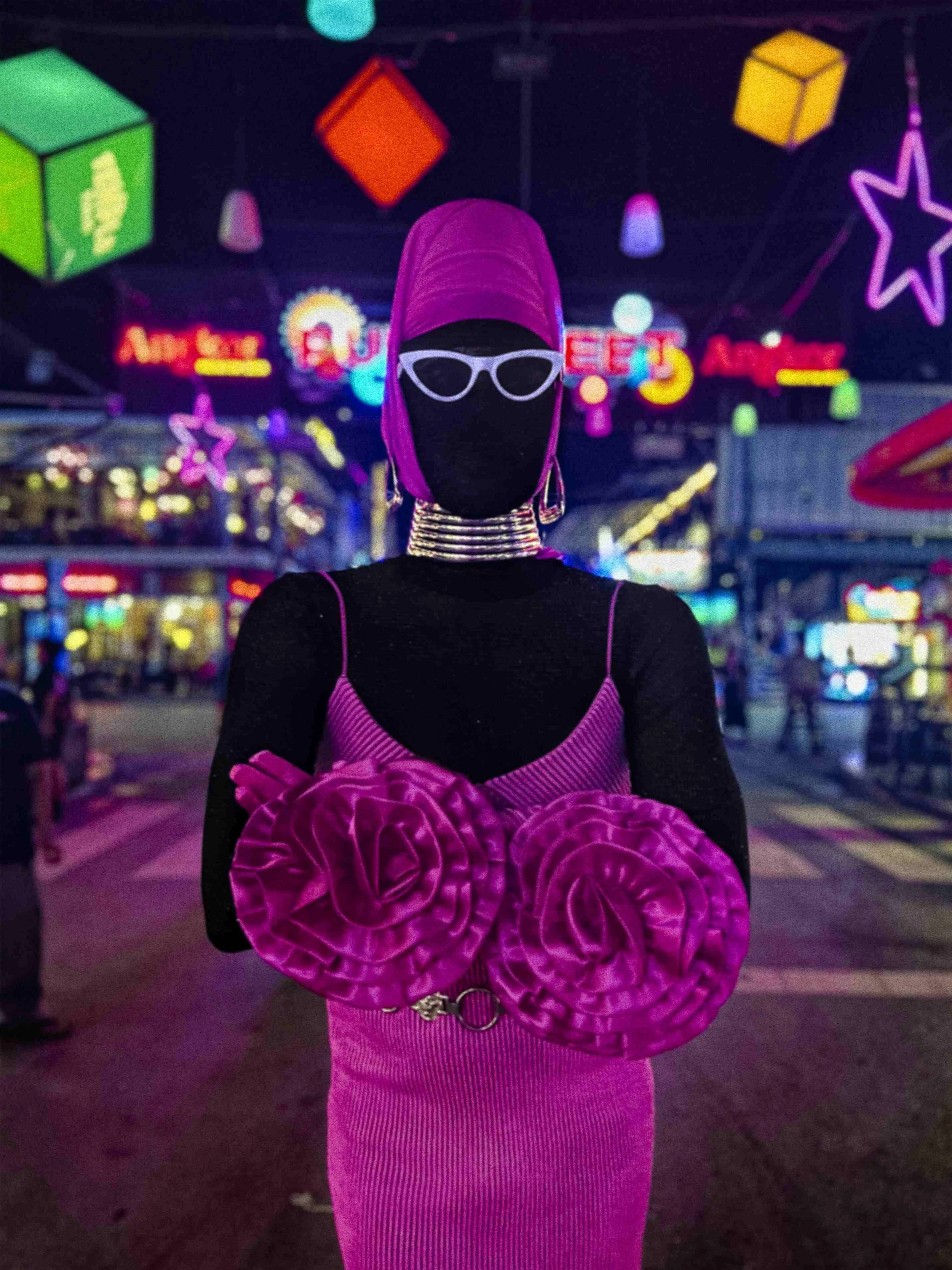 Salma Zahore, a queer Arab icon, wearing white glasses that cover her face, dressed in a full pink gown, in the streets of Siem Reap with a lot of neon lights around her.