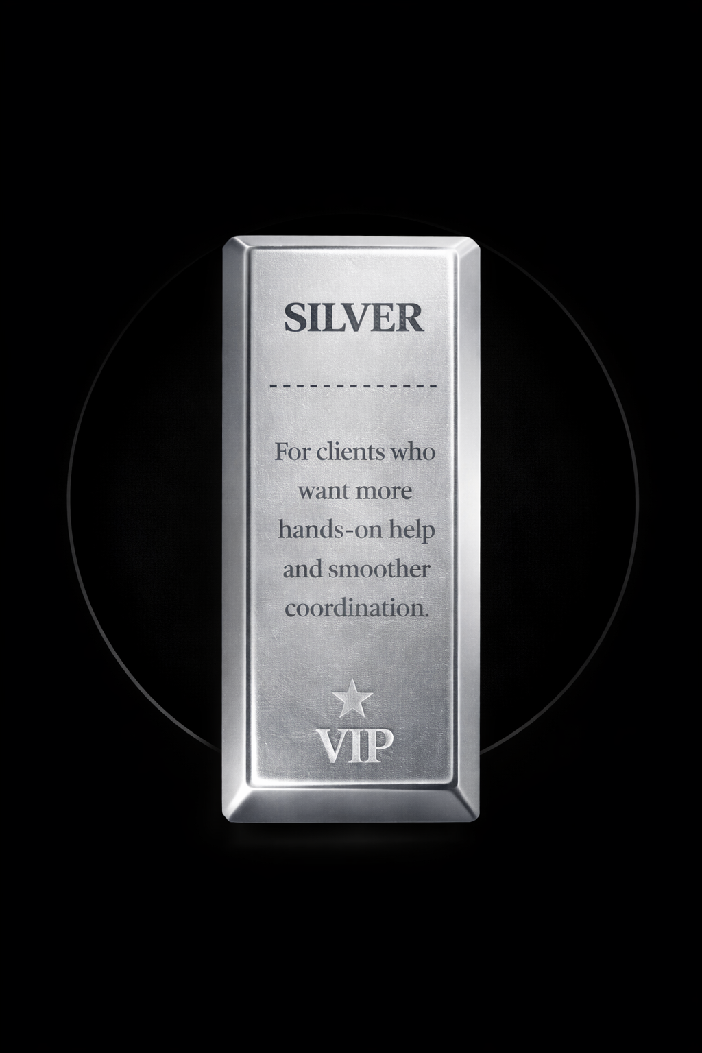 Mountain range with snow-capped peaks and a modern building on a grassy hillside.