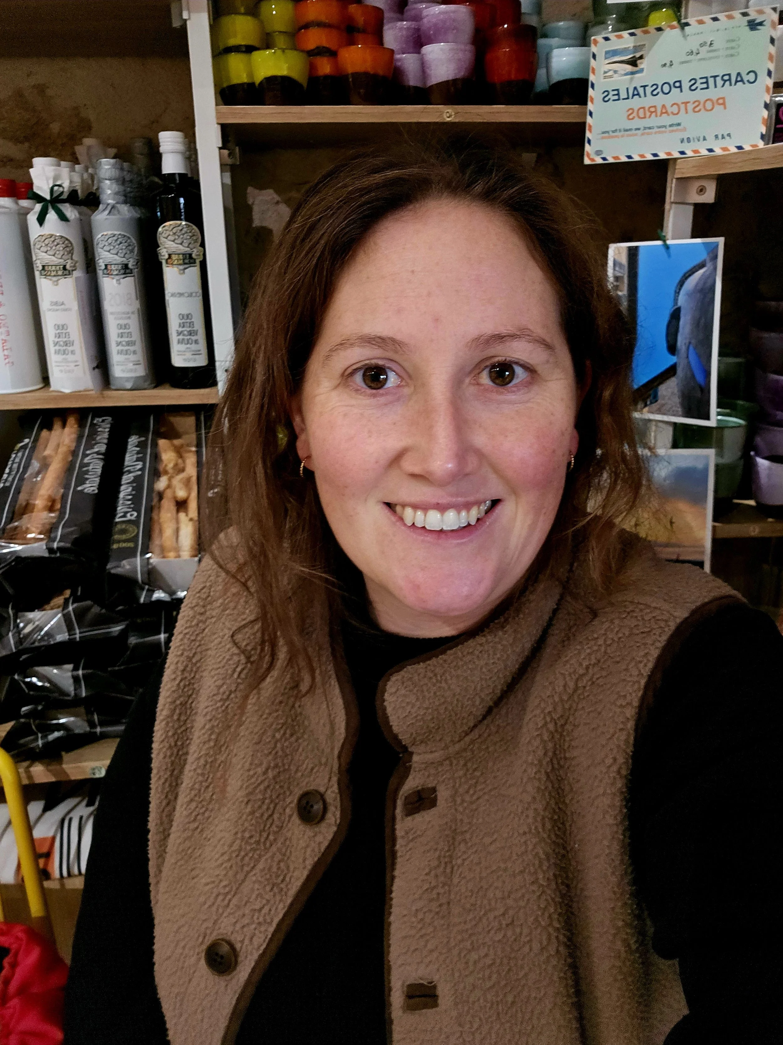 A smiling headshot of Rosanna from The French Way tutoring in a French deli.