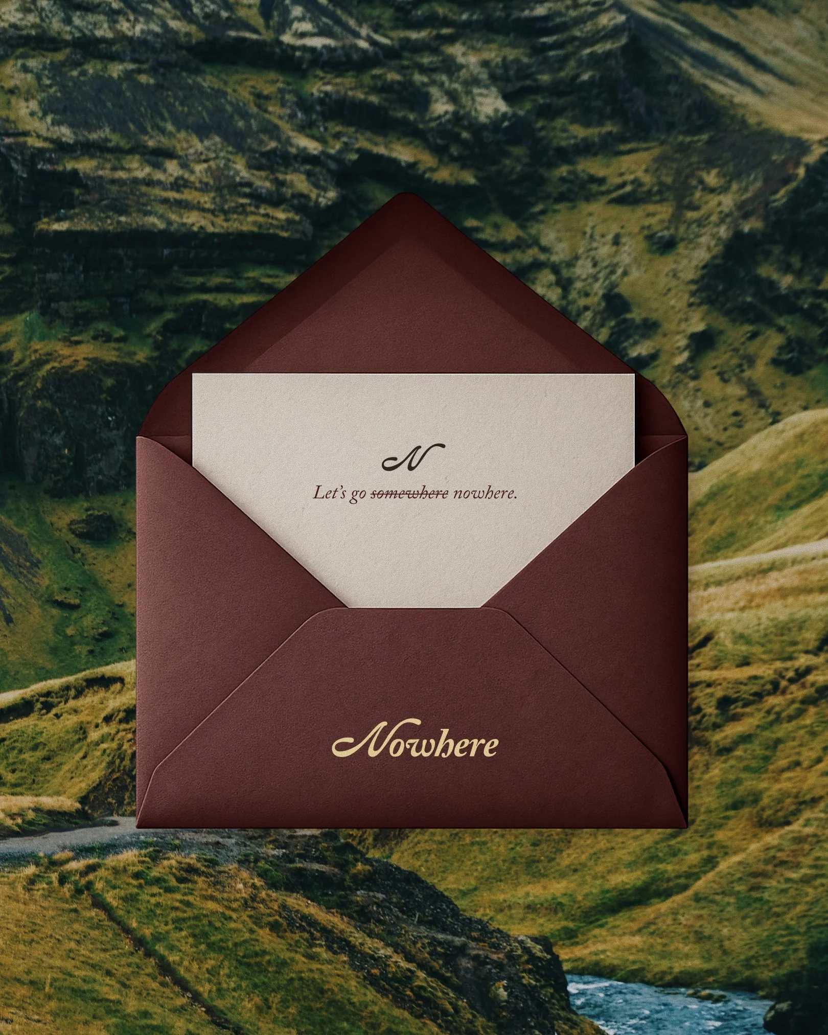 Image of an envelope in front of an Icelandic waterfall