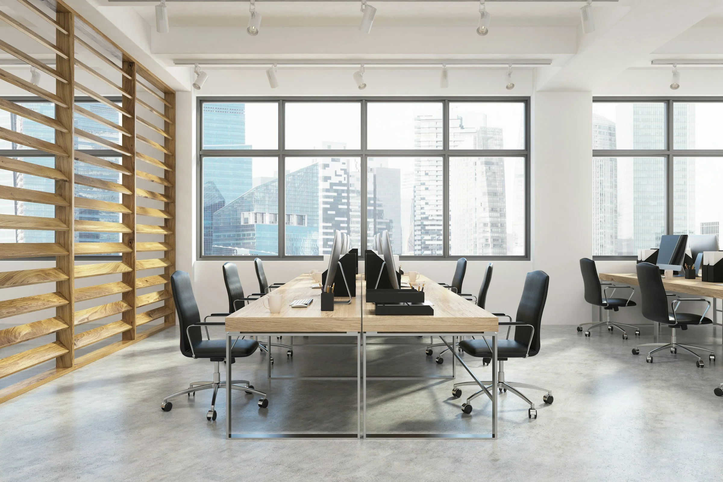 Light bright office space with desks and chairs