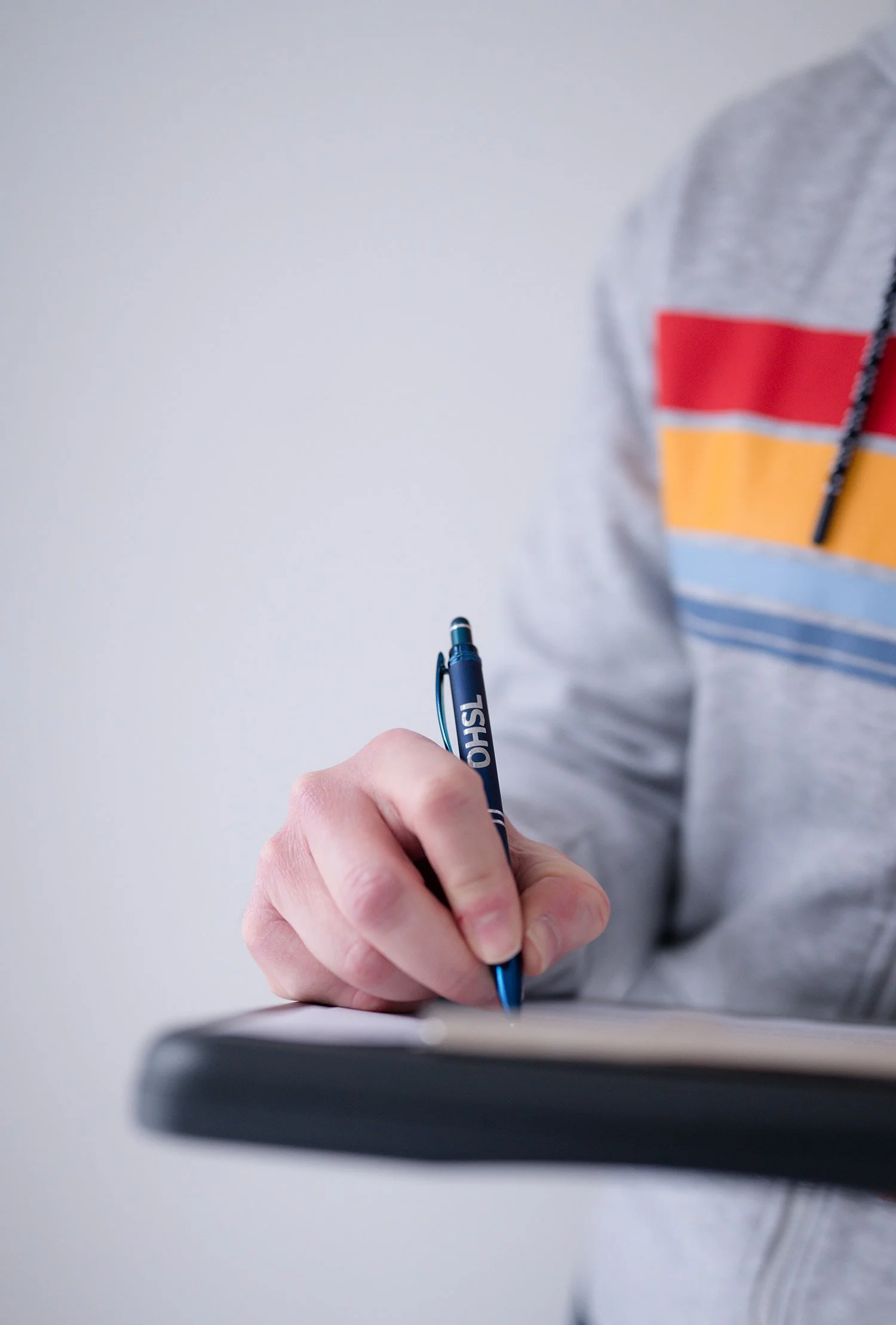Occupational hygienist writing on pad