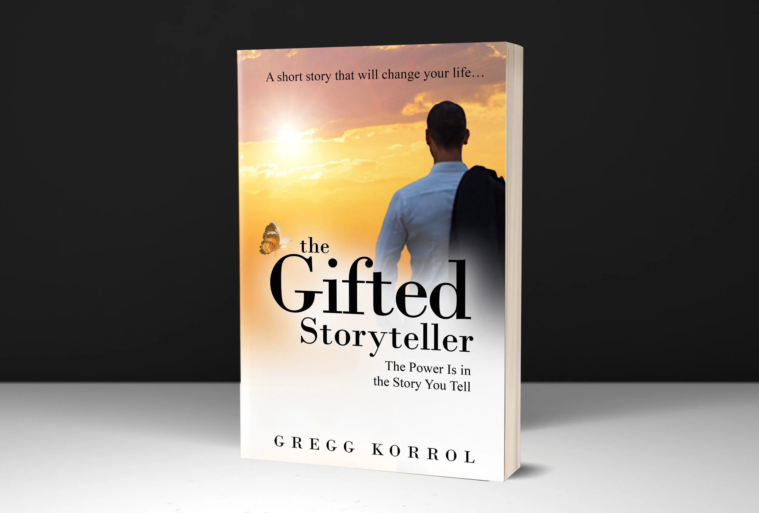 Book titled 'The Gifted Storyteller' with subtitle 'The Power Is in the Story You Tell,' featuring a cover image of a man looking at a sunset sky with clouds and a butterfly. Gregg Korrol-Create the life you've been waiting for. Award winning.