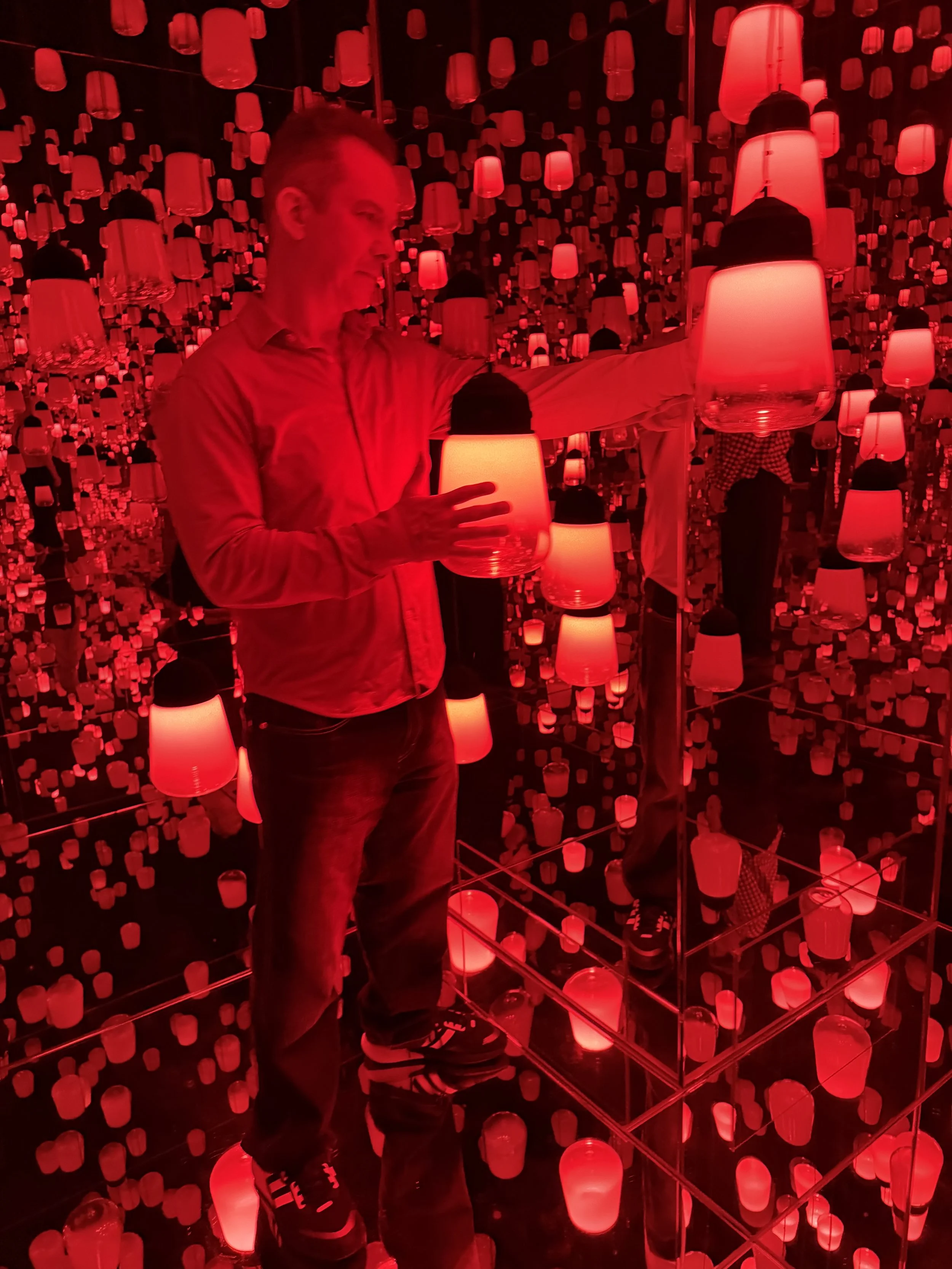 Team Lab Kyoto a room filled with red illuminated paper lanterns hanging with mirrors reflecting the lanterns. Gregg Korrol- The Gifted Storyteller. Create the life you've been waiting for and dreaming of.
