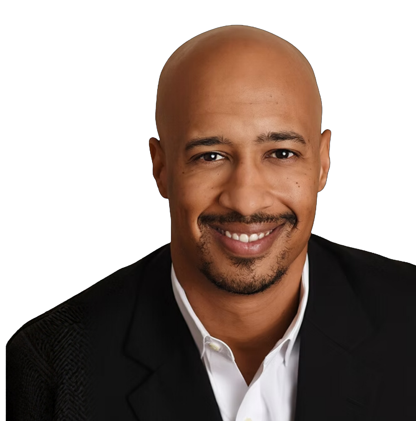 Headshot of a smiling bald man with a goatee, wearing a black suit jacket and white shirt, set against a dark background.