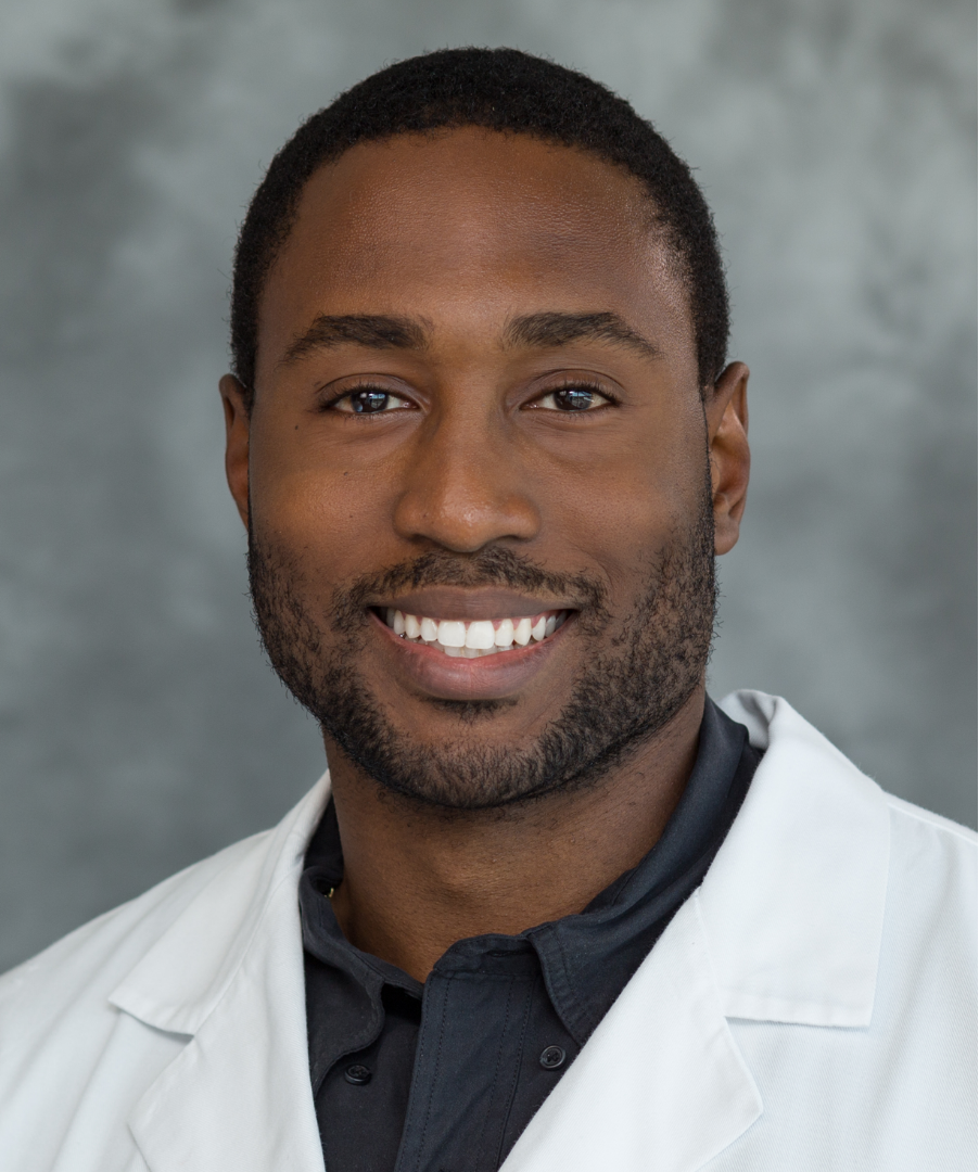A professional headshot of Dr. Richard Harris wearing his white coat.