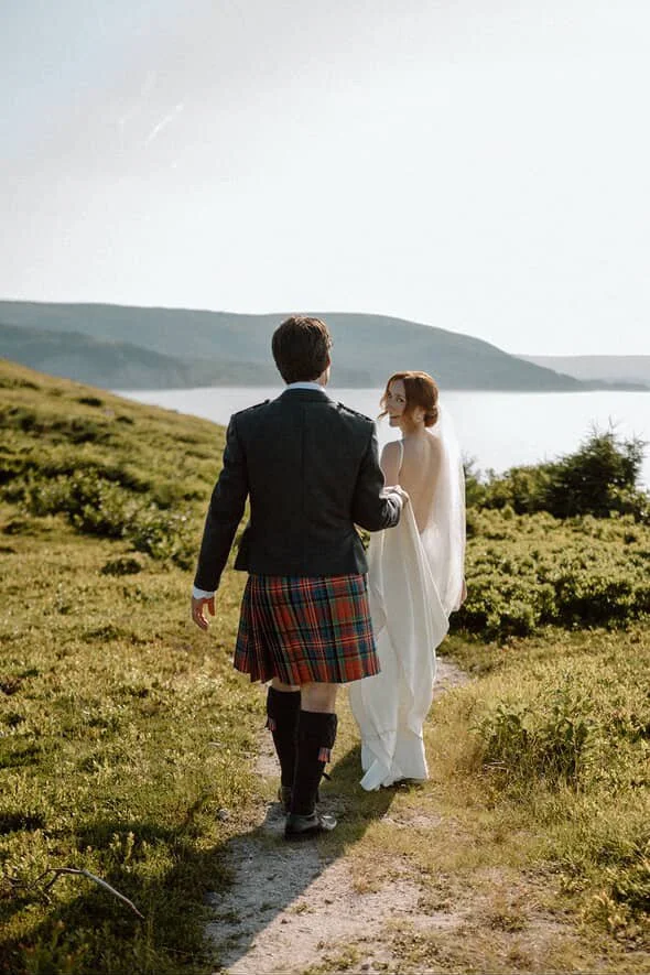 Laurie’s customers, Evan and Kade, running down a mountain after getting married. 