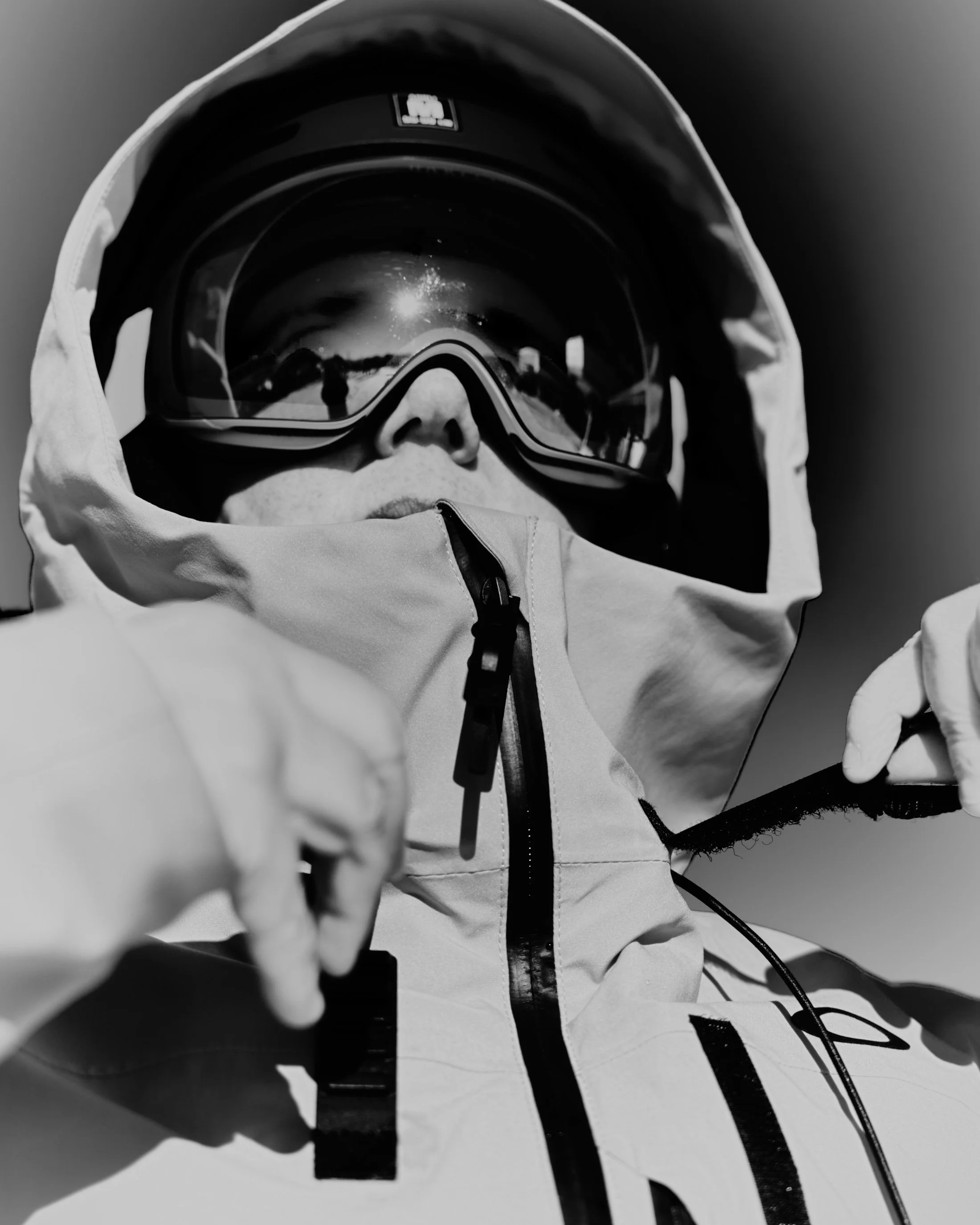 A close-up image of a skier in adapted outdoor clothing.