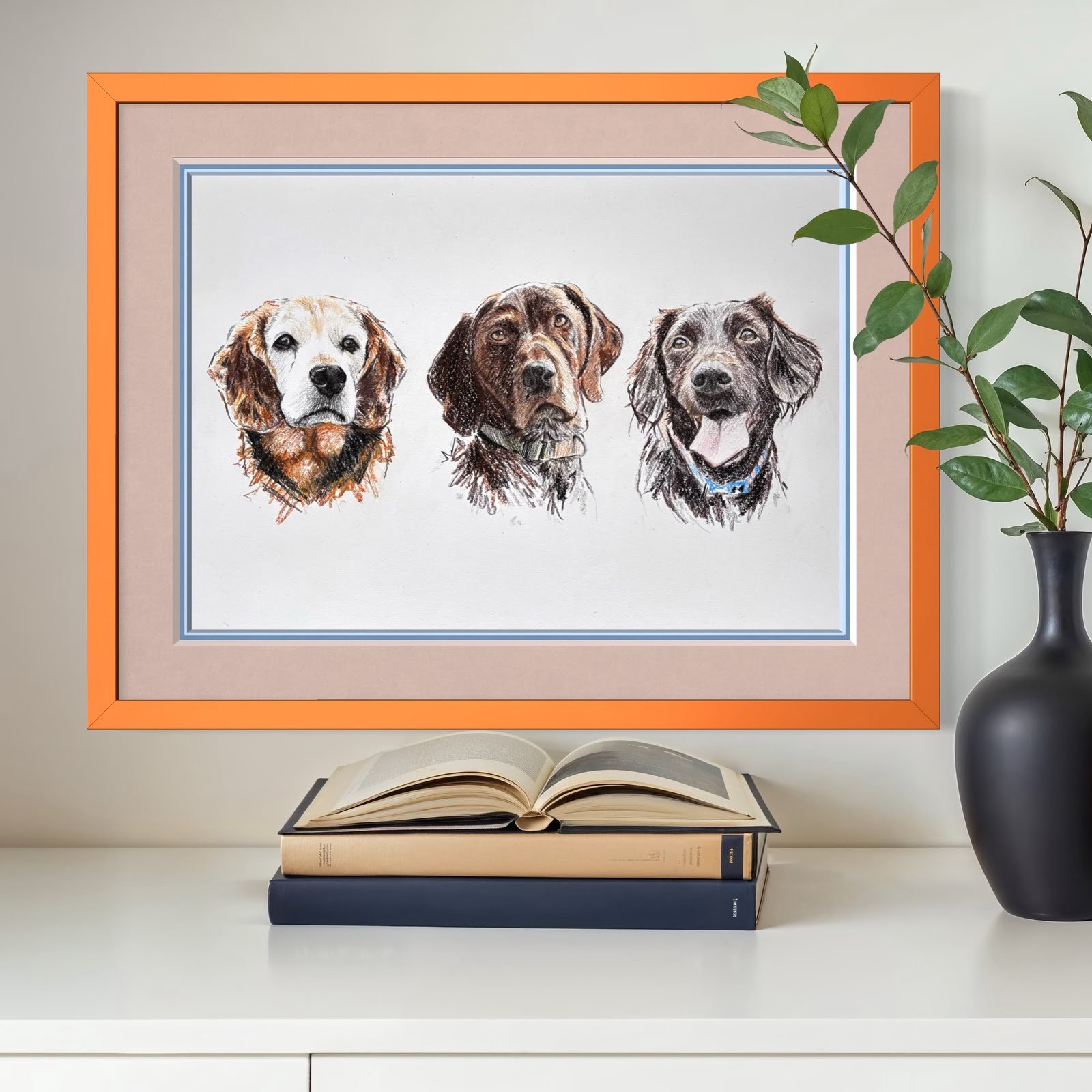 Framed pet portrait of three dogs on wall