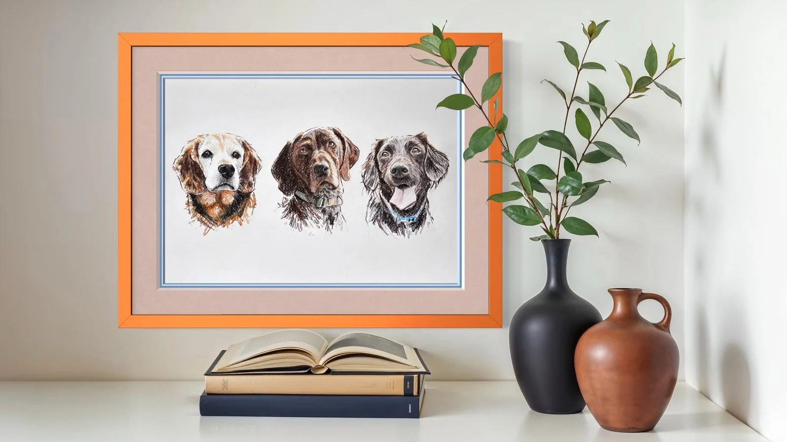 Framed pet portrait of three dogs on modern home wall