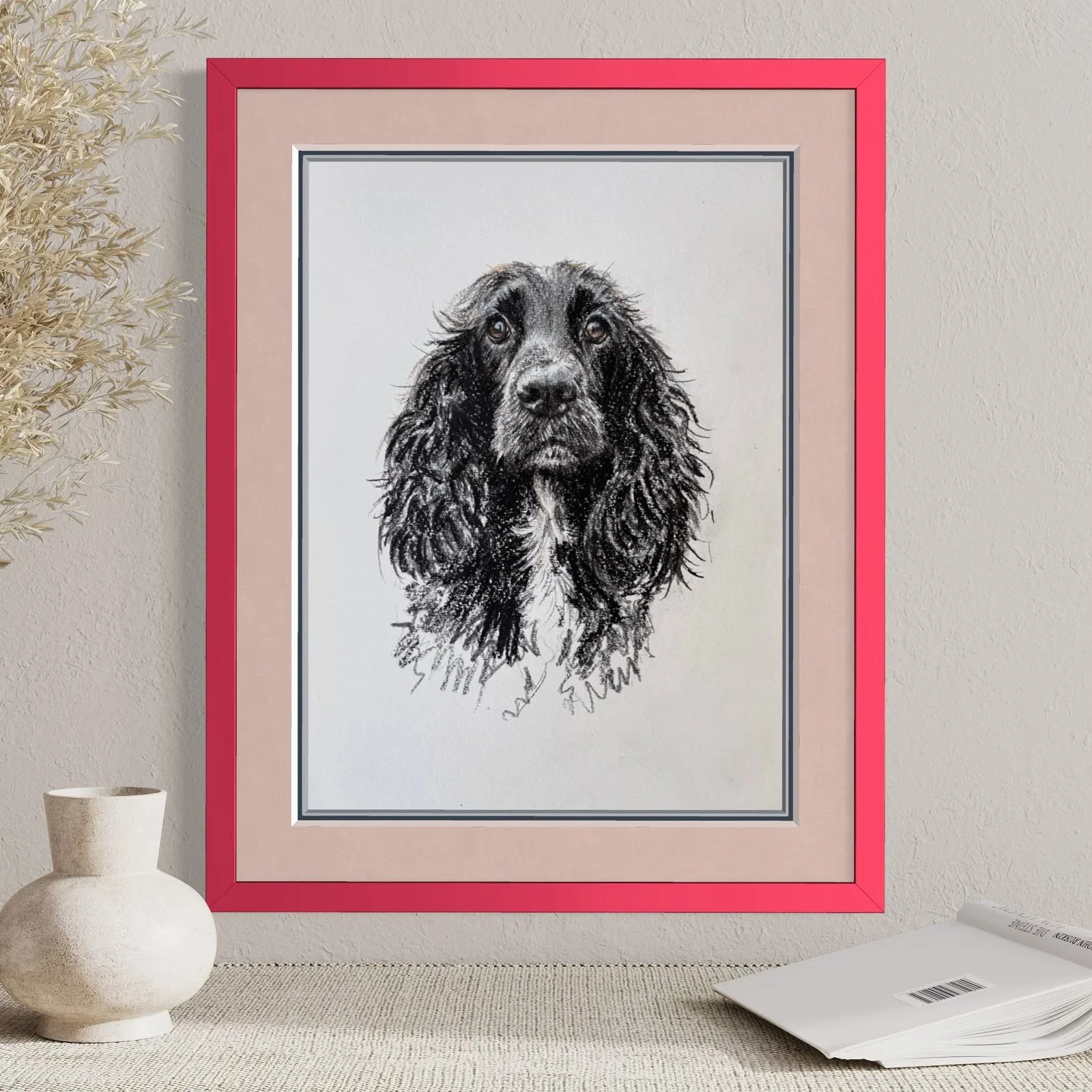 Framed cocker spaniel drawing on wall in modern home close up